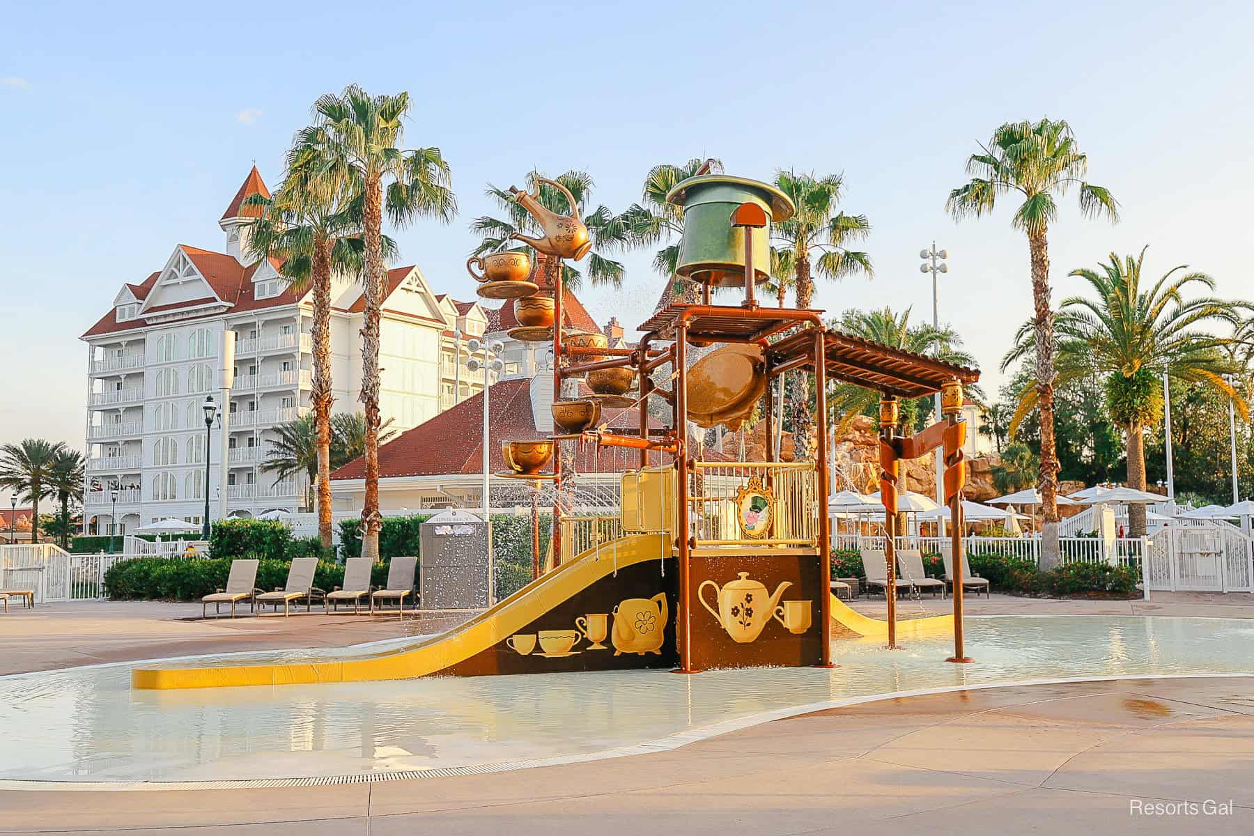 the Alice in Wonderland teacups splash pad at sunset 