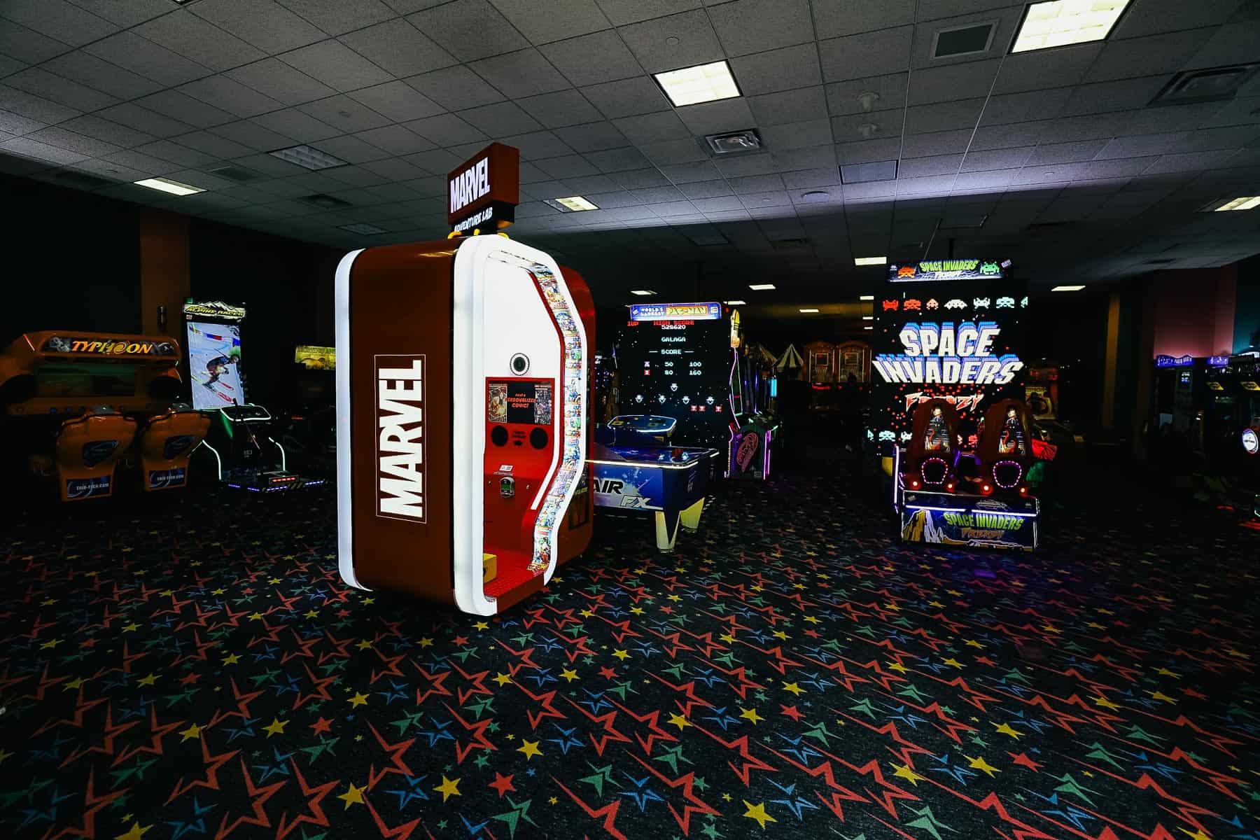 the interior of the arcade with various games 