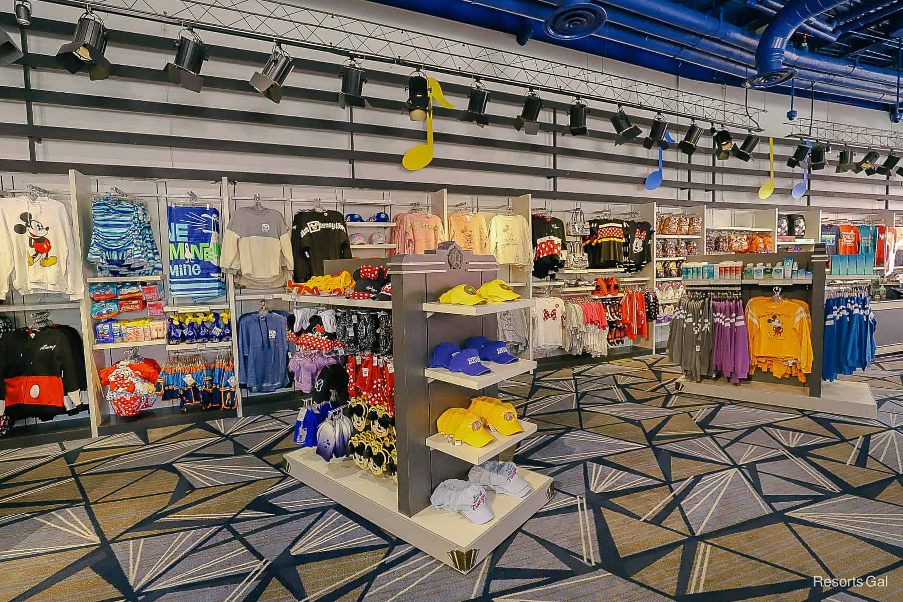 merchandise displays with hats and apparel in the All-Star Music Gift Shop 