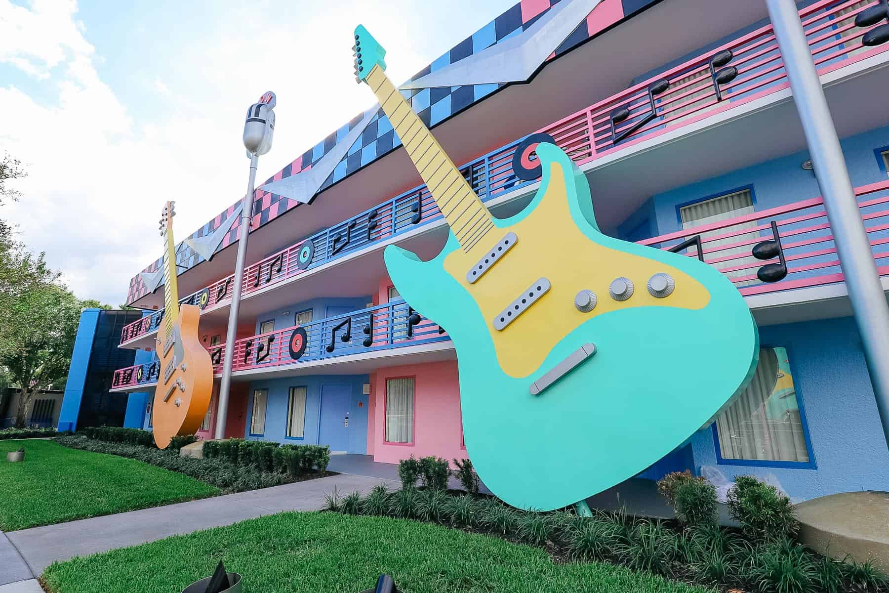 giant electric guitars in mint green and yellow at the Rock Inn section of All-Star Music 
