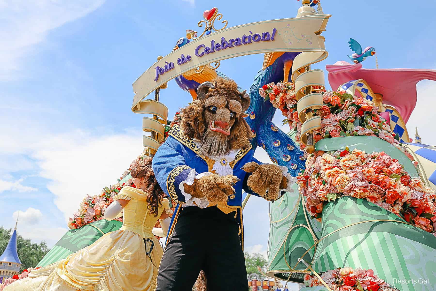 Beast waves to the crowd during the Festival of Fantasy Parade 