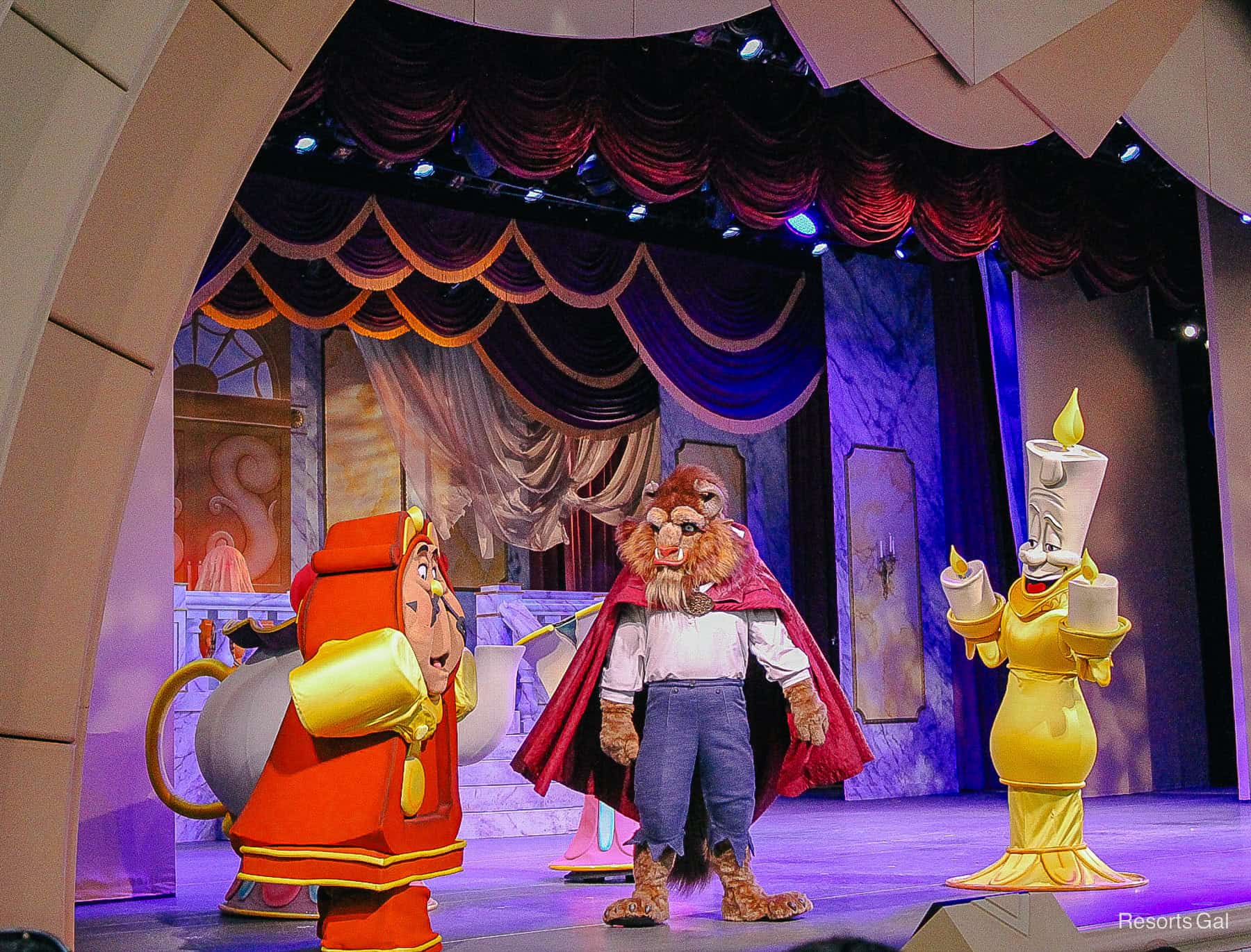 The Beast with Cogsworth and Lumiere live on stage at Hollywood Studios. 