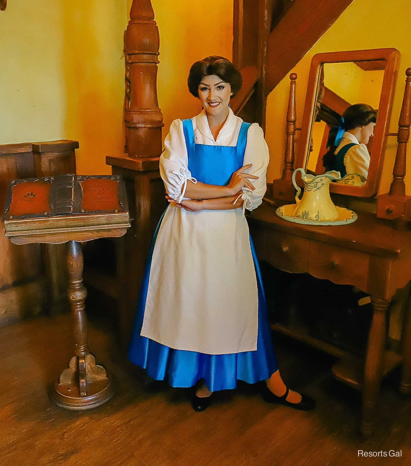 Belle in blue village dress at Maurice's Cottage 