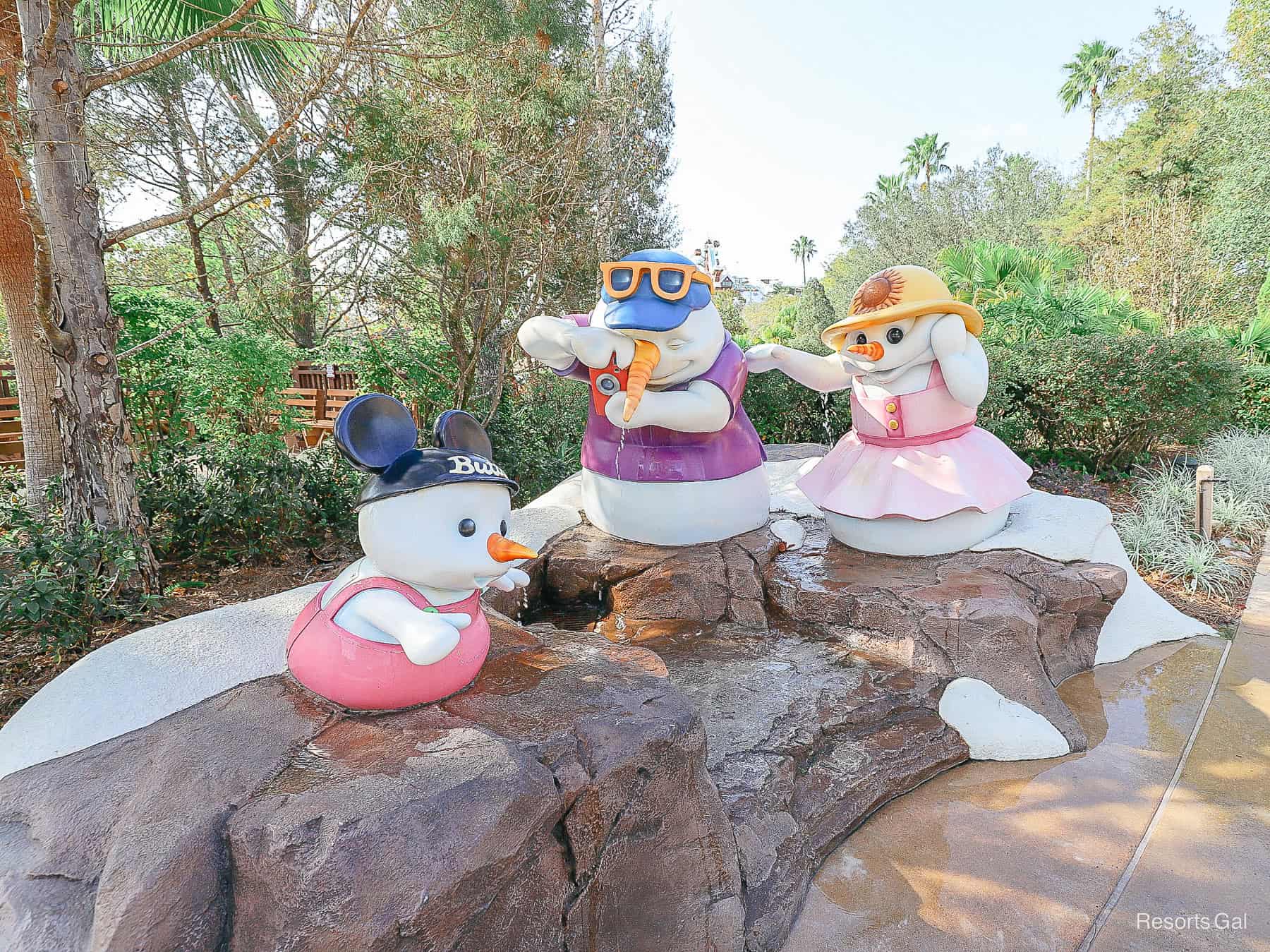 a snow man family enjoying Blizzard Beach 