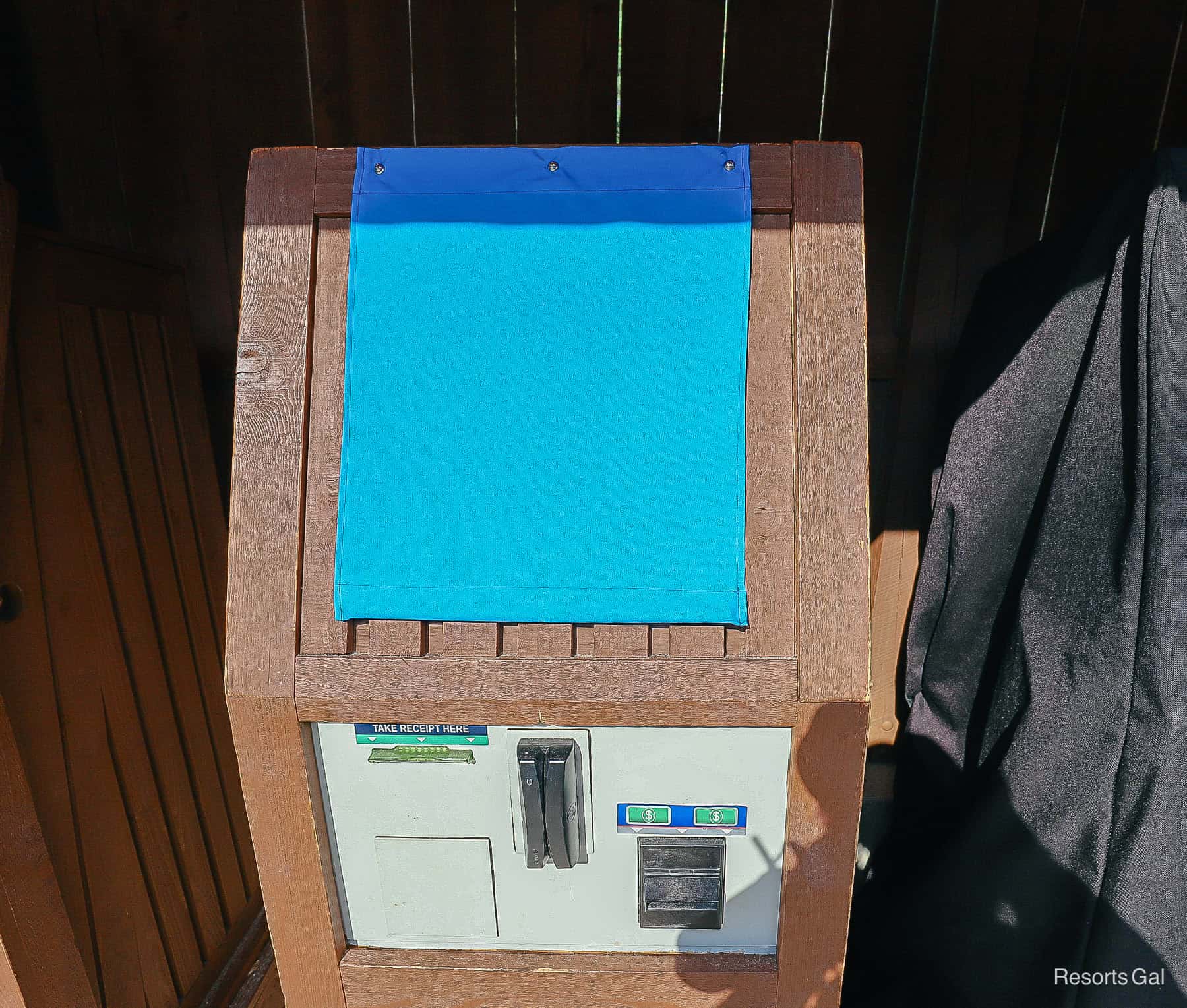 a cover protecting the kiosk from the sun 