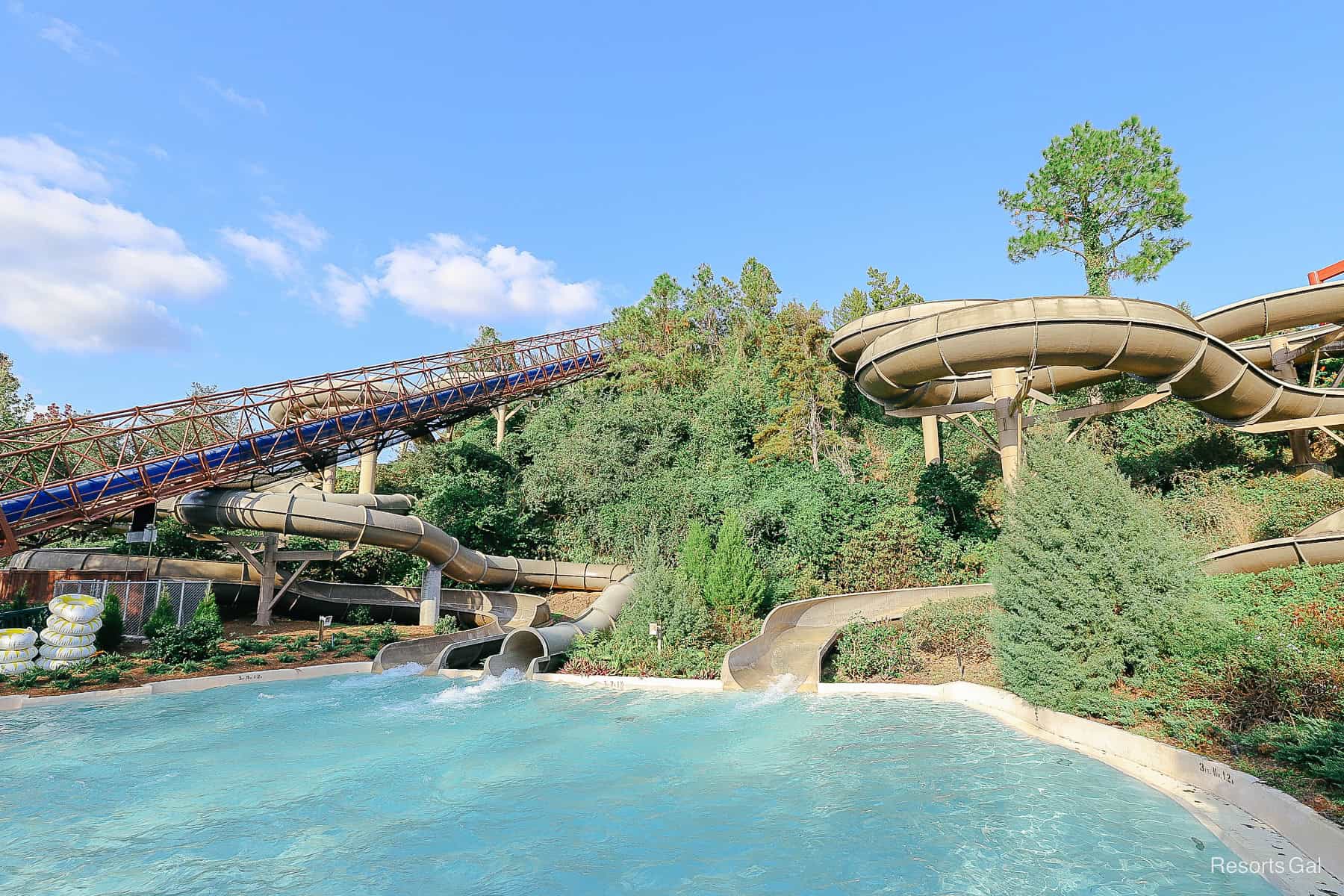 water rushing into the pool at the base of the slide 