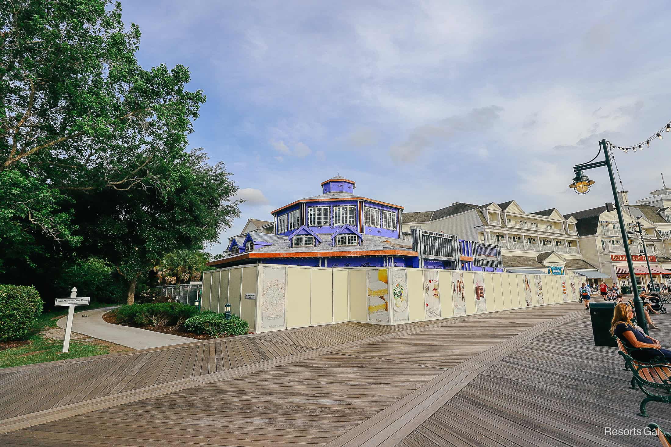 the progress of the Cake Bake Shop on Disney's Boardwalk with blue walls and white trimmed windows 