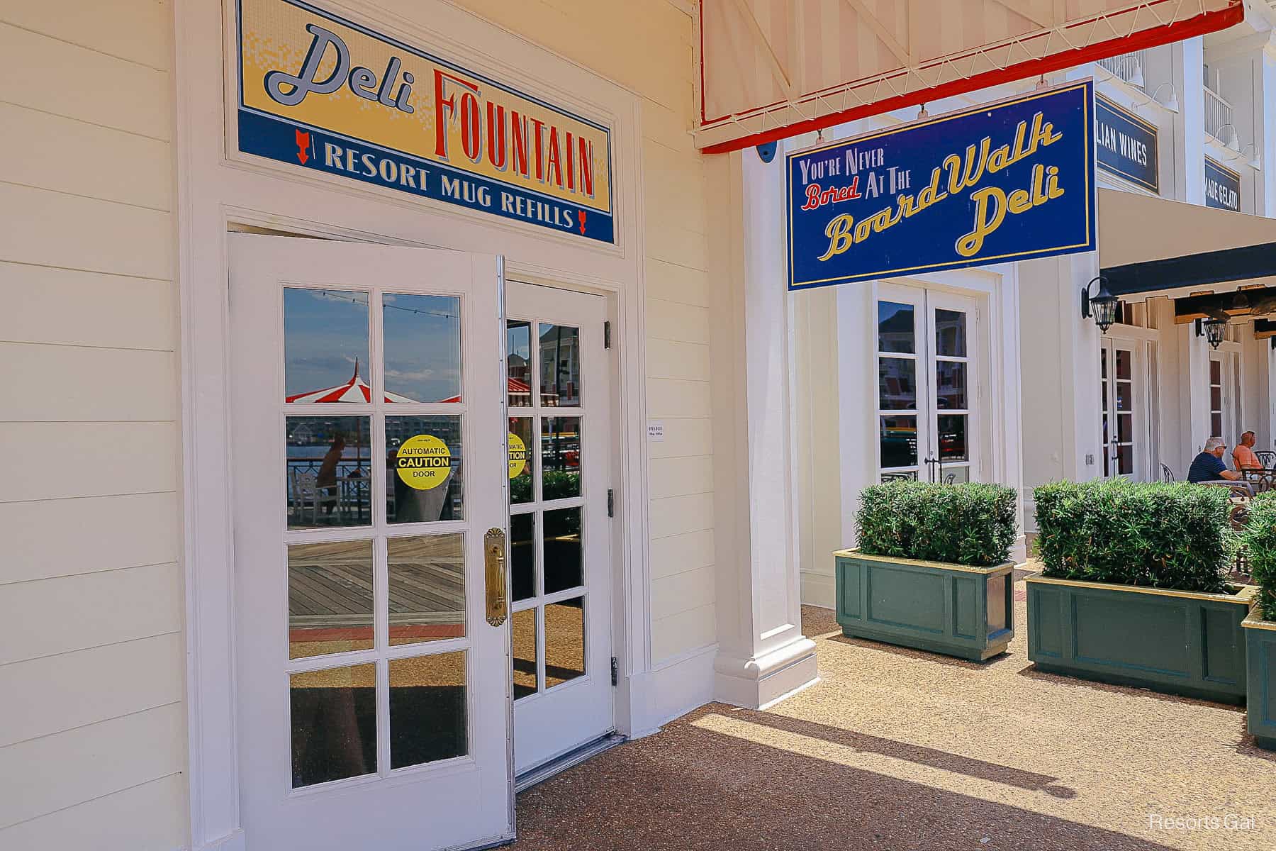 the deli fountain sign indicates where guests can fill resort mugs at Disney's Boardwalk