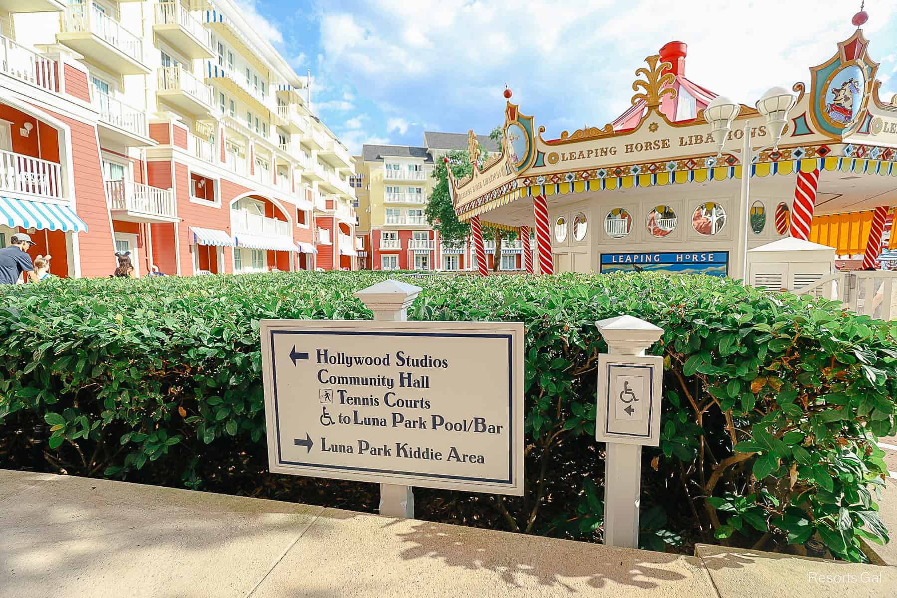 a directional in front of the pool at Disney's Boardwalk that points to the shortcut to Hollywood Studios 