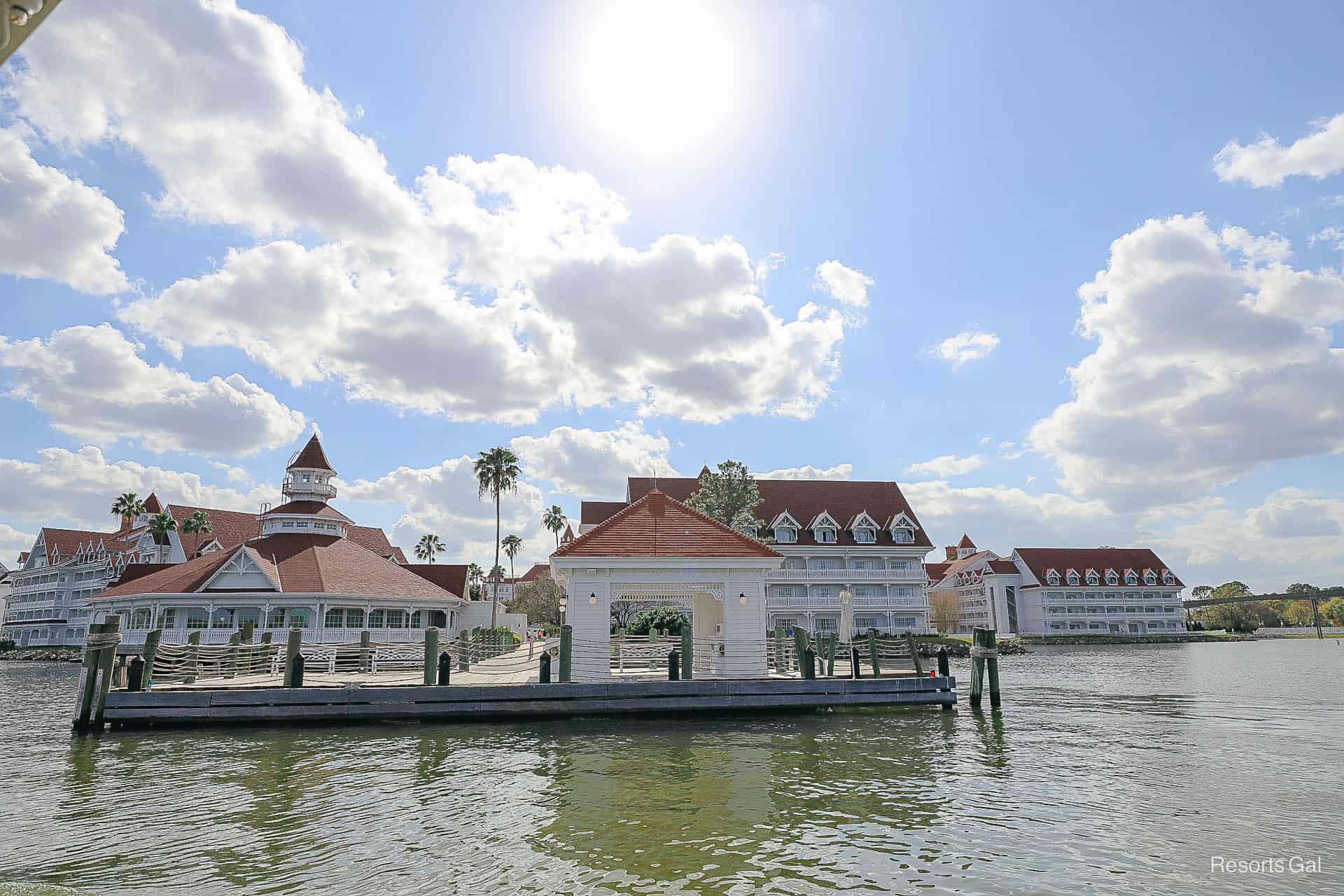 the bat dock has a small covered area with a red roof and bench 