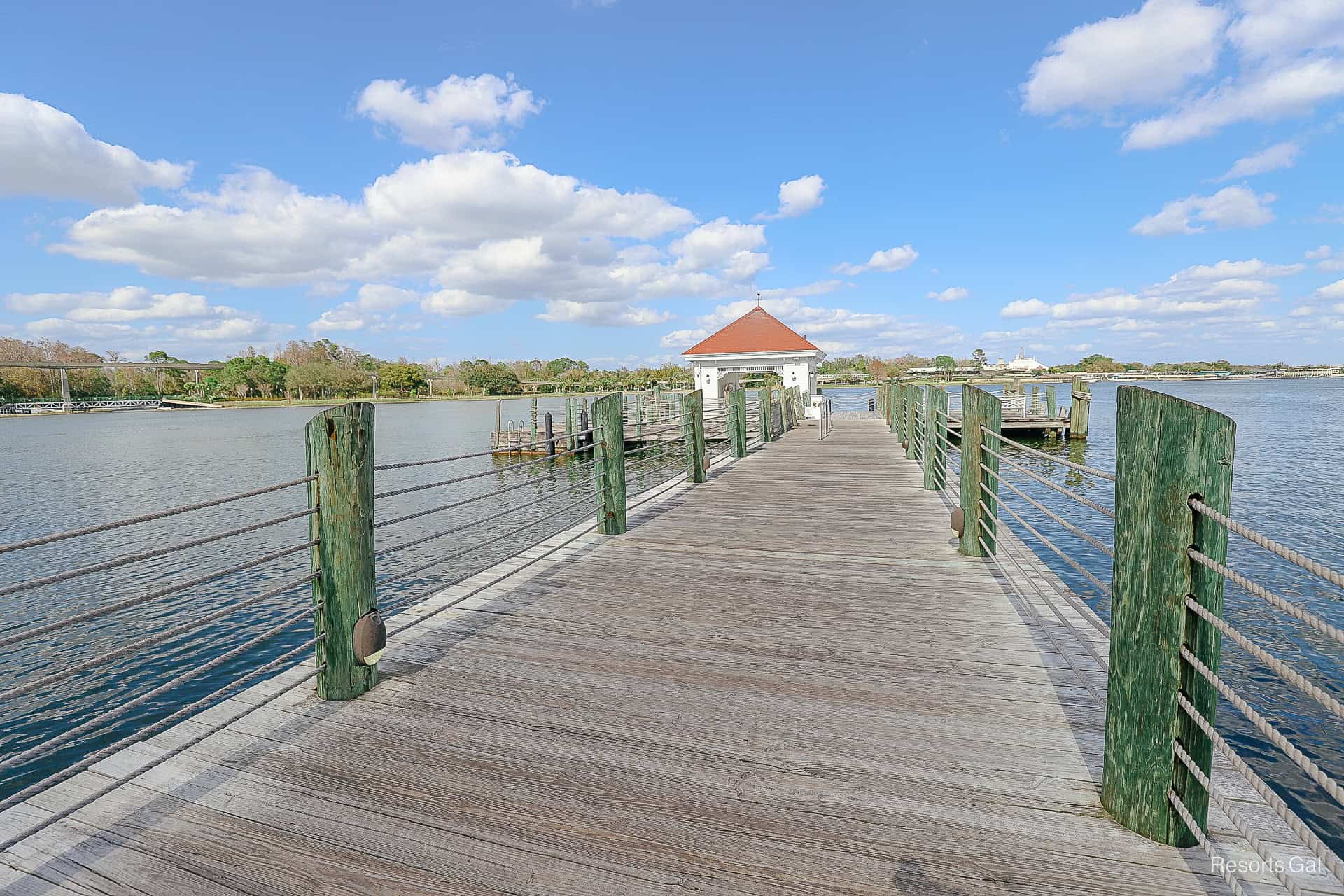 the boat dock on the water with a deck and loading area at the end 