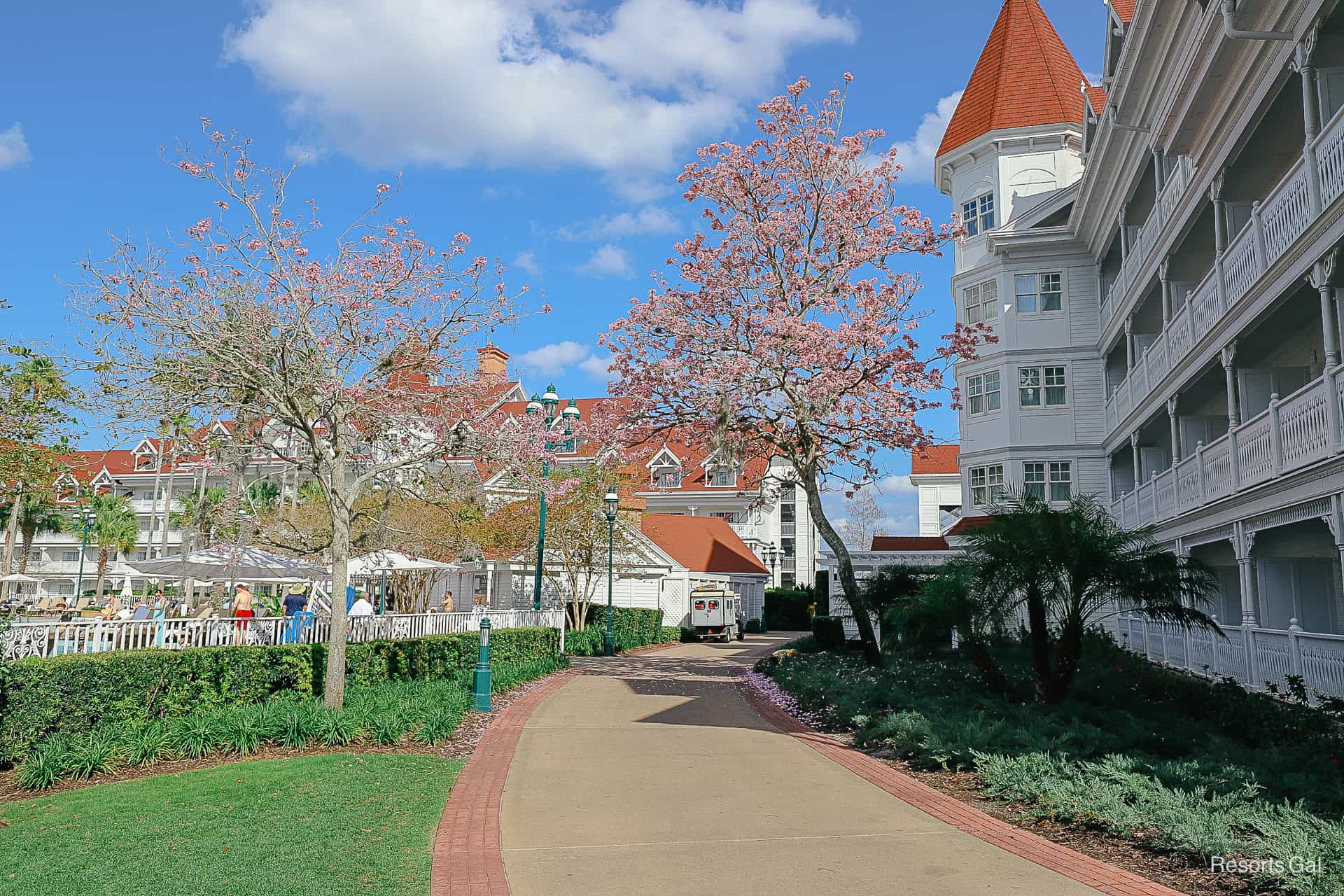 an outdoor walking path that leads through the Grand Floridian 