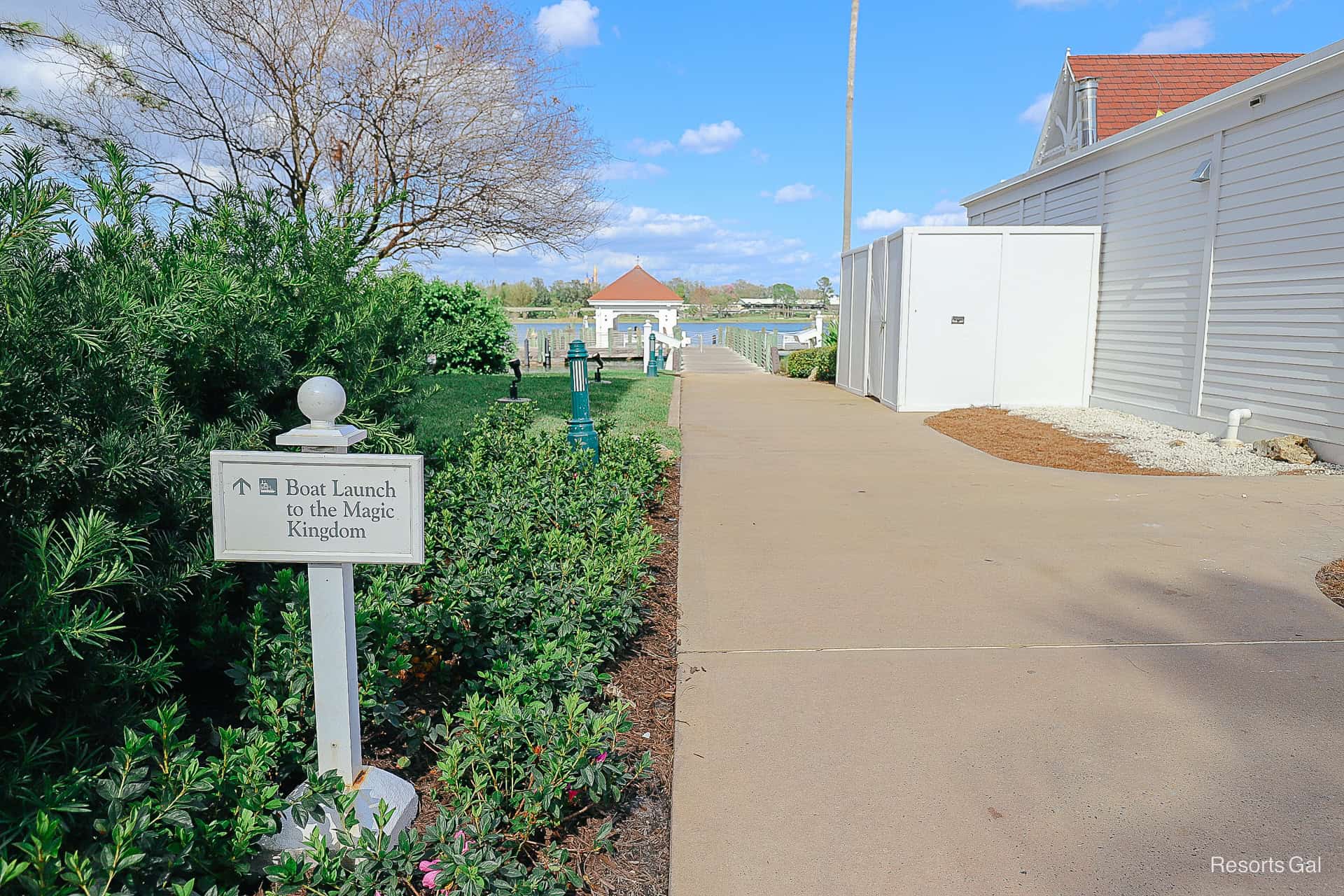 a sign that reads Boat Launch to Magic Kingdom with an arrow directional 