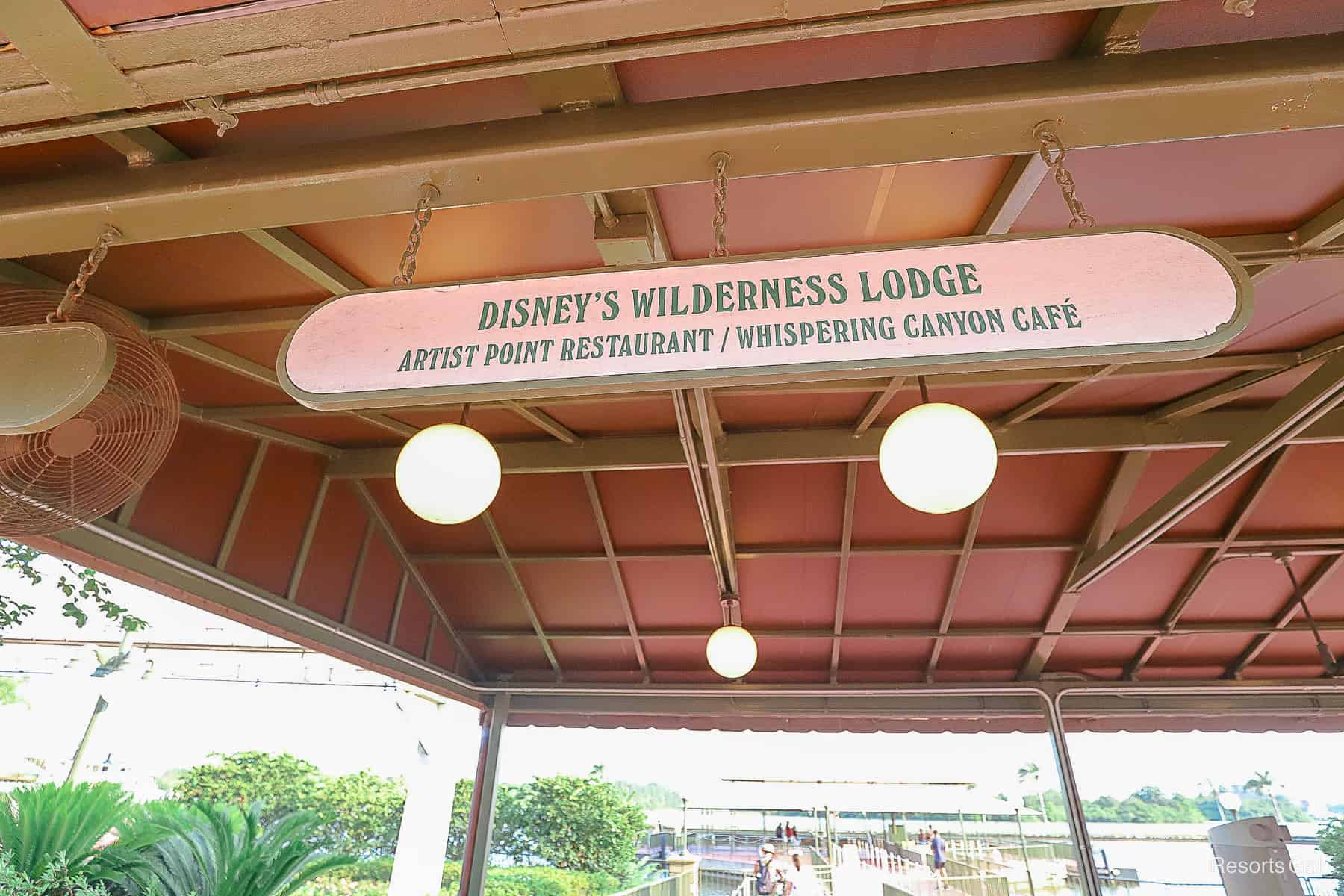 sign overhead indicating where to get in line for the Wilderness Lodge boat when leaving Magic Kingdom 