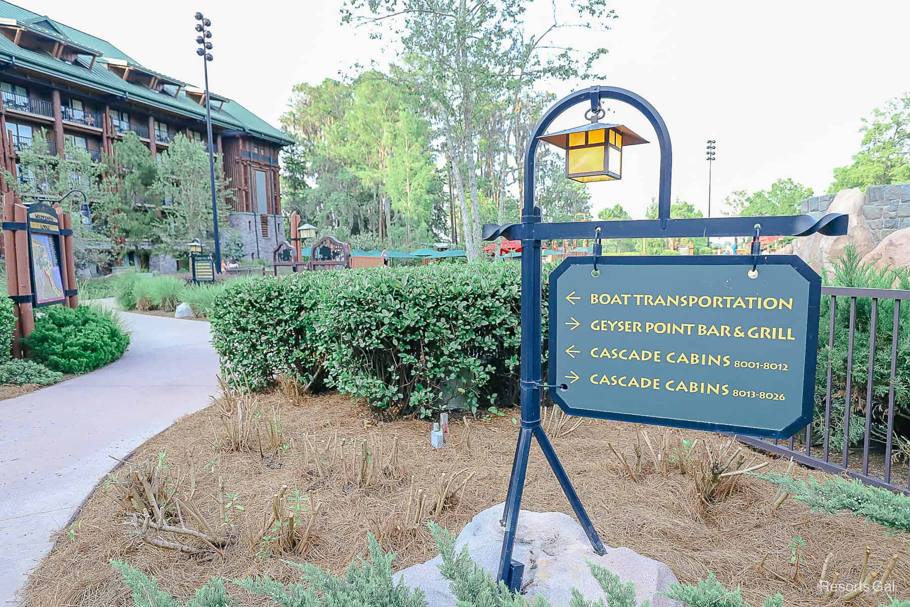 a sign that points the path to boat transportation at the Wilderness Lodge 