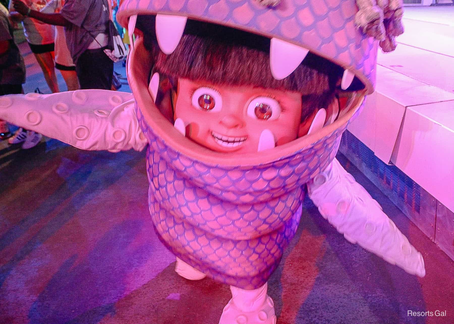 Boo from 'Monsters, Inc.' at Disney World. She is wearing her monster costume. 