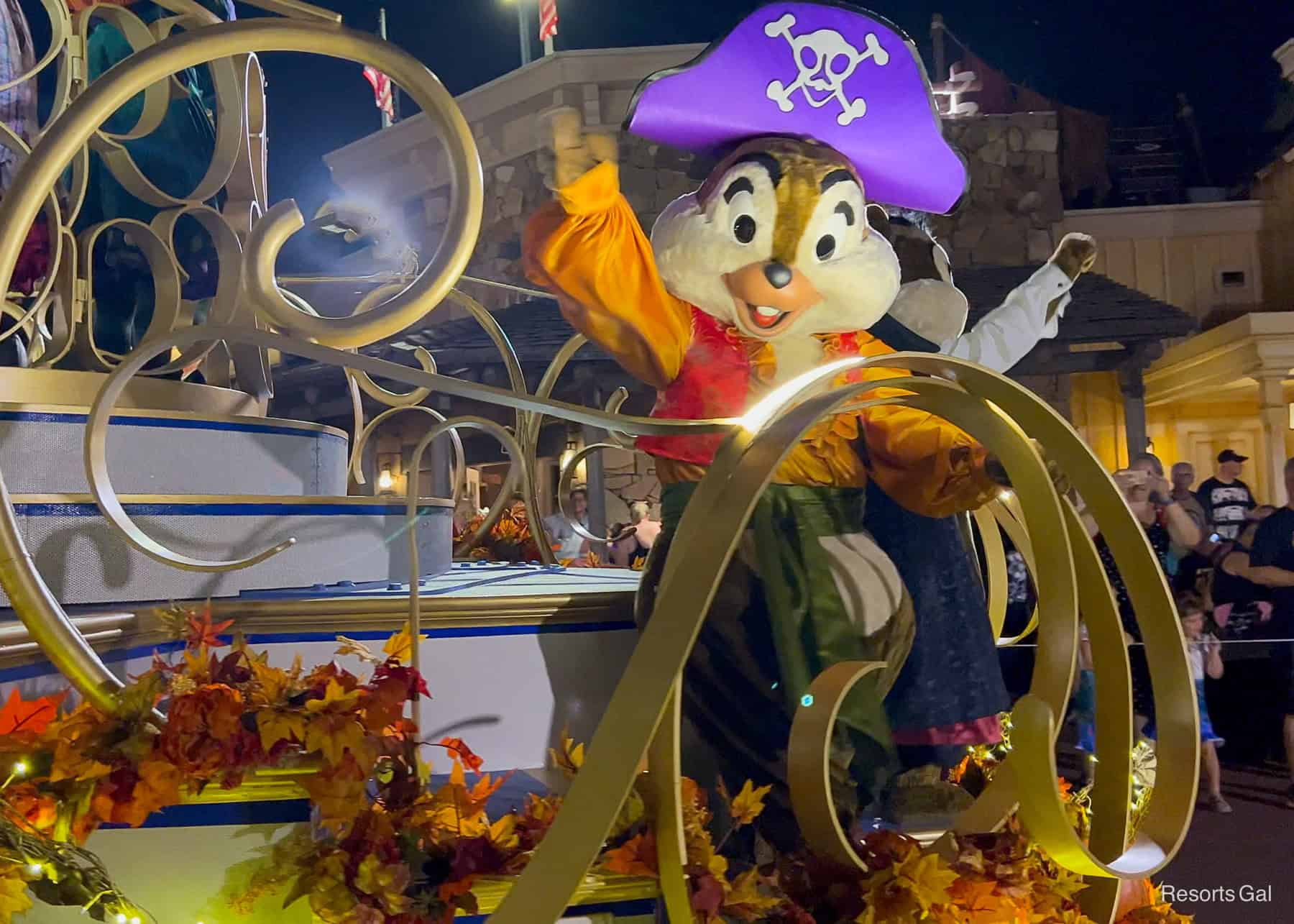 Chip is dressed as a pirate and Dale is a vampire on the other side as characters in the Boo To You Parade 