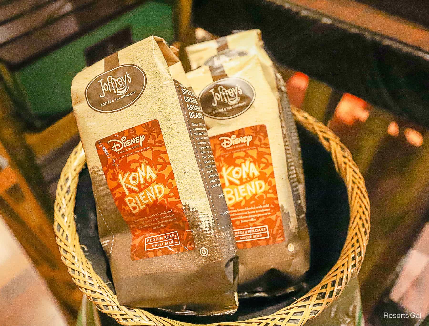 Kona Blend packages of coffee in a basket 