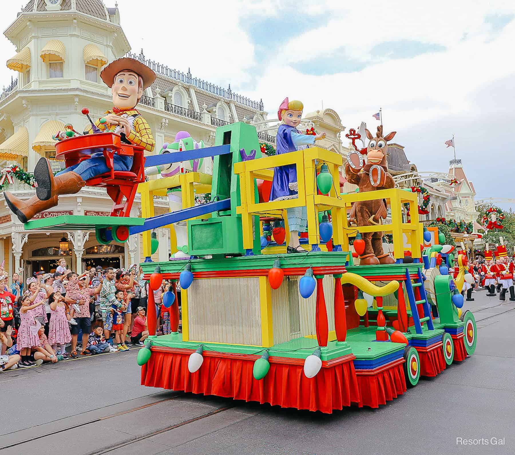 Woody rides in the front of the Toy Story parade float in Mickey's Once Upon a Christmastime Parade 