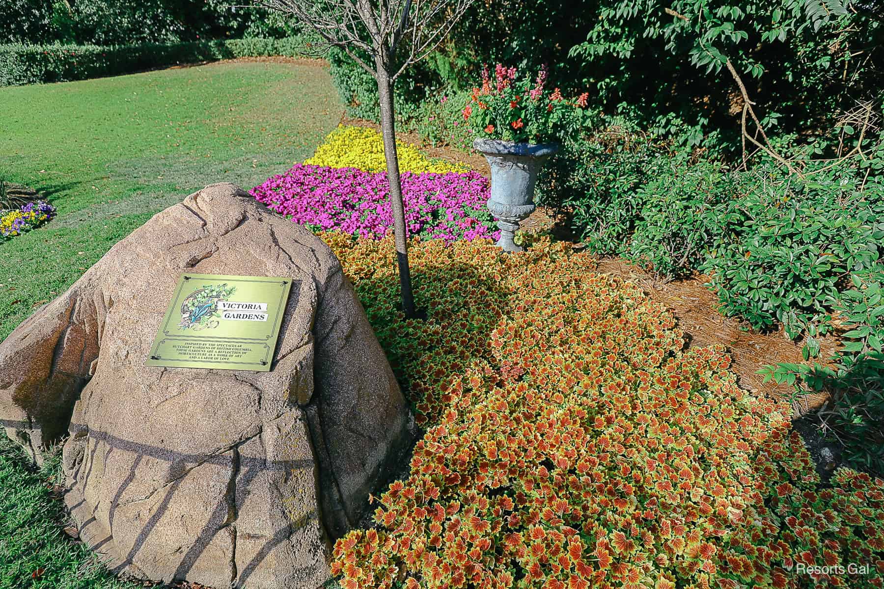 a plaque that says Victoria Gardens in Epcot's Canada Pavilion 