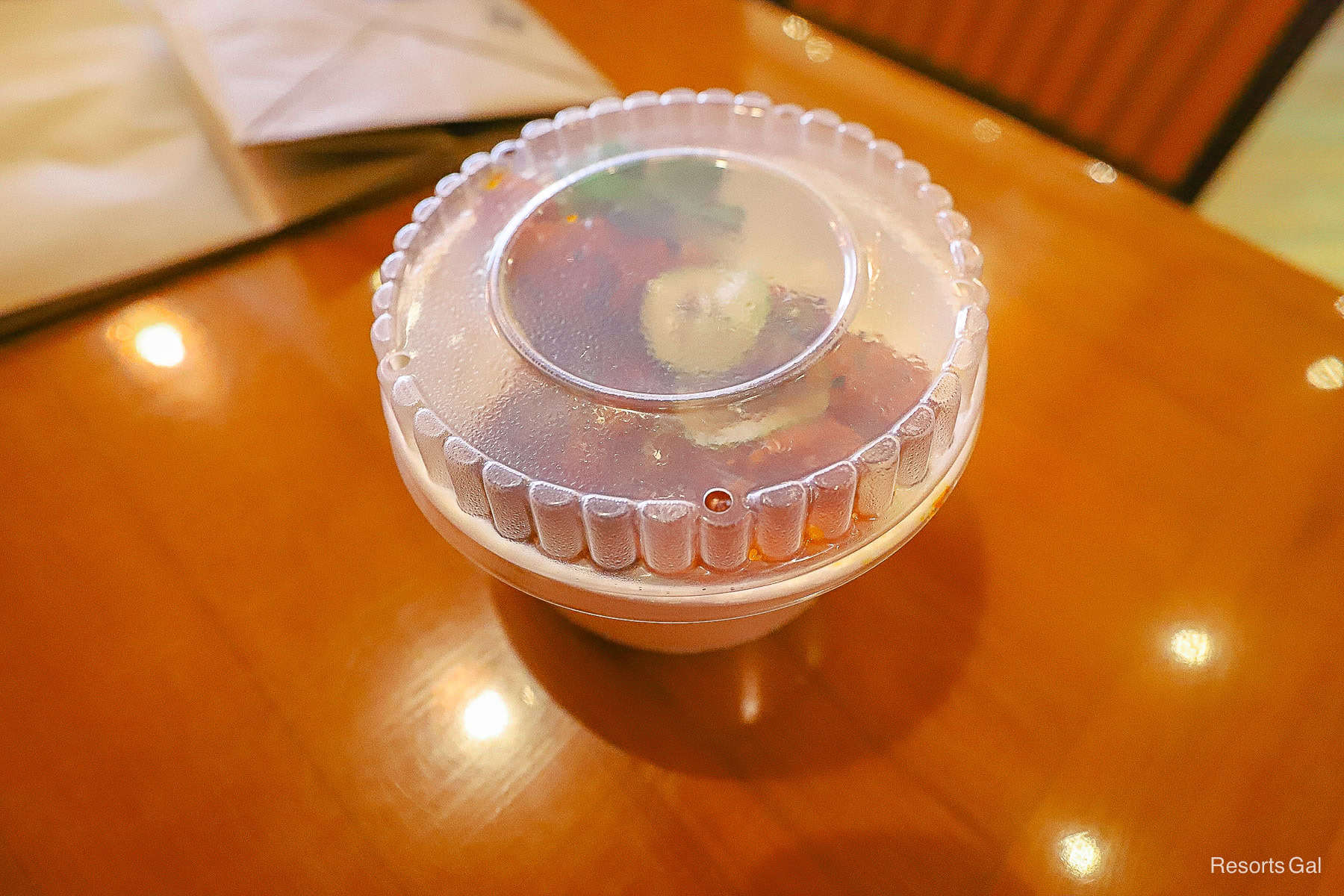 a covered to-go container from Capt. Cook's 