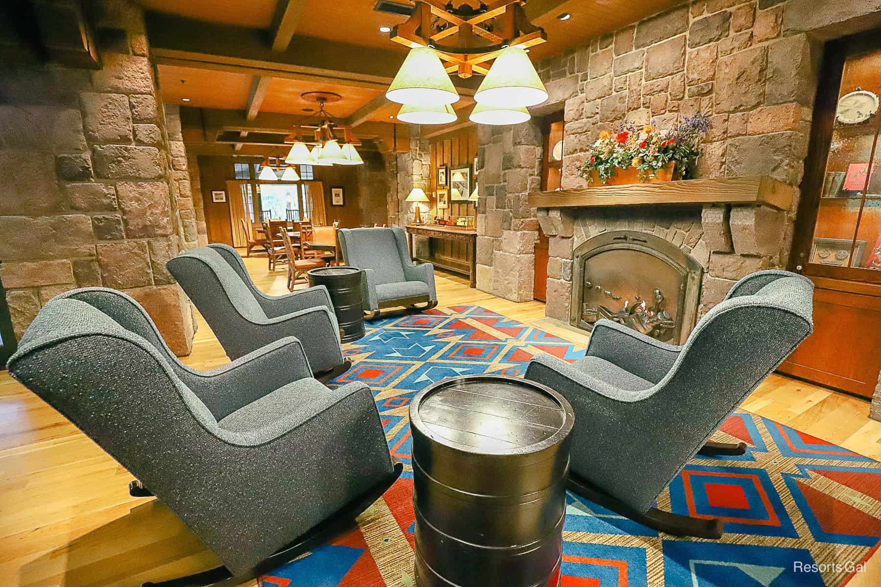 the train room at Disney's Wilderness Lodge with chairs around the fireplace 