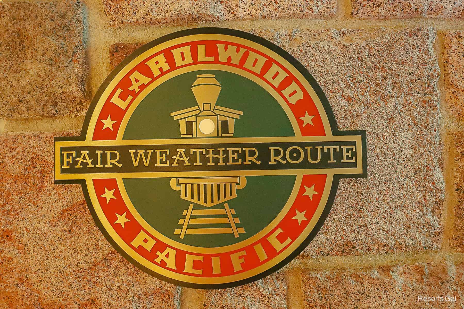 a metal sign that says Carolwood Pacific Fair Weather Route 