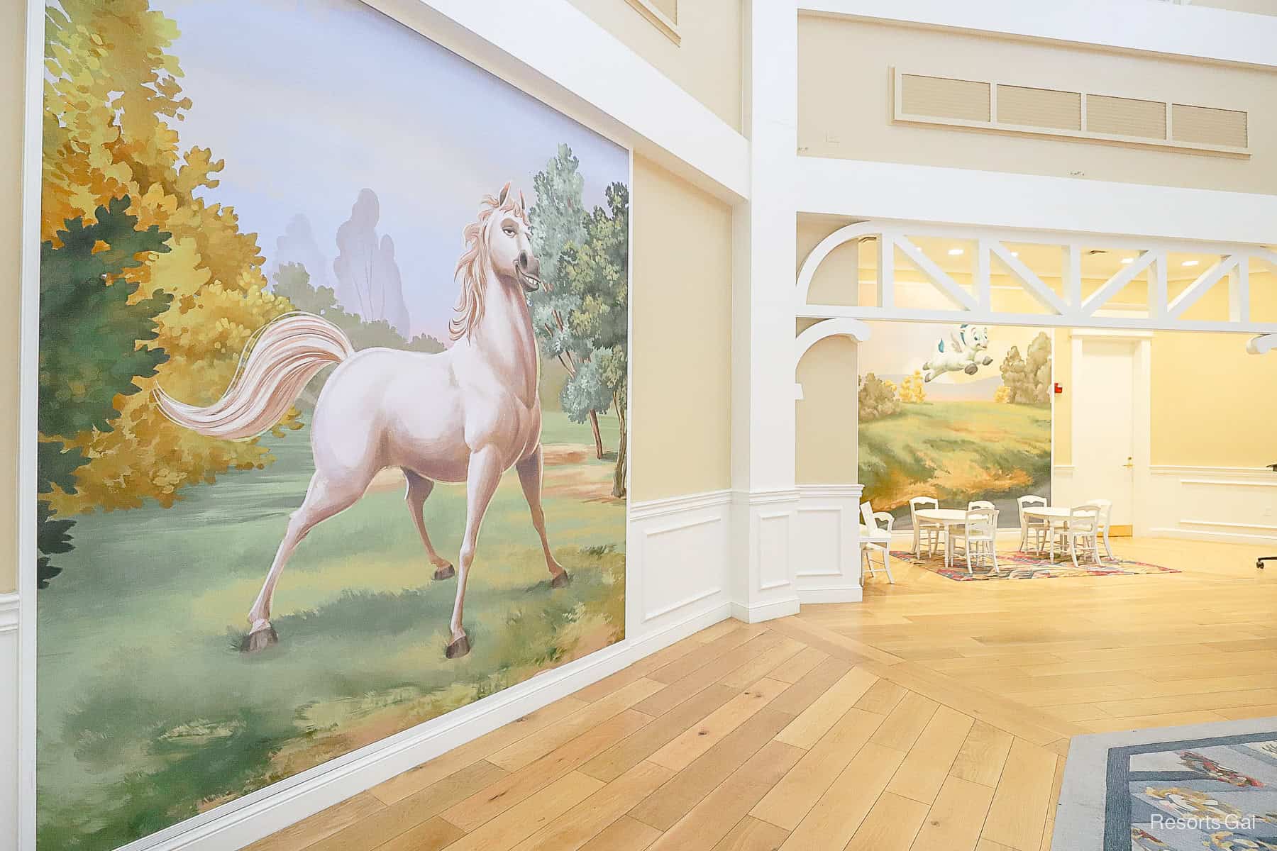 another horse painting with a children's nook in the background 