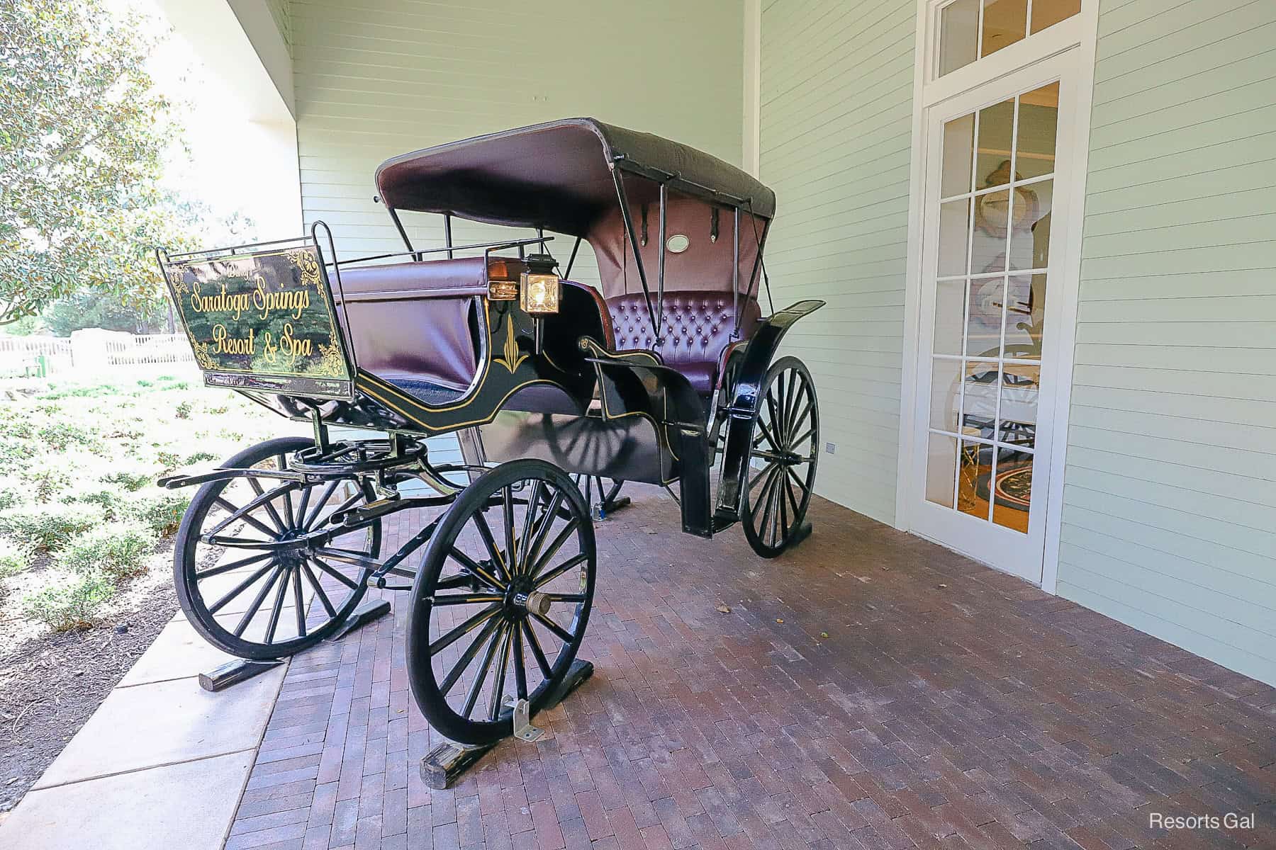 an old fashioned horse drawn carriage that welcomes guests to the lobby 