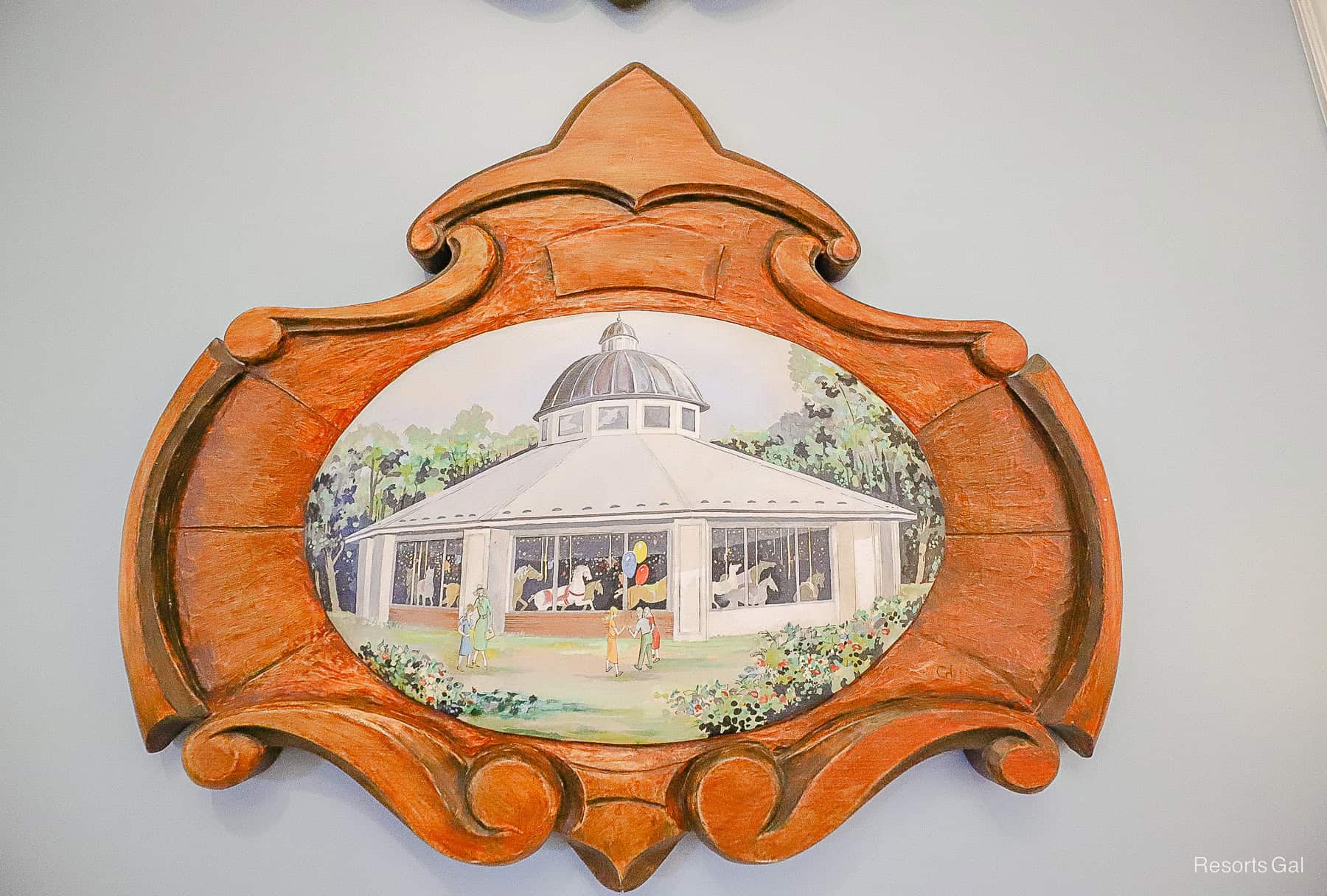 a painting depicting Walt Disney and his daughters at the merry go round hangs in the lobby of Disney's Saratoga Springs 