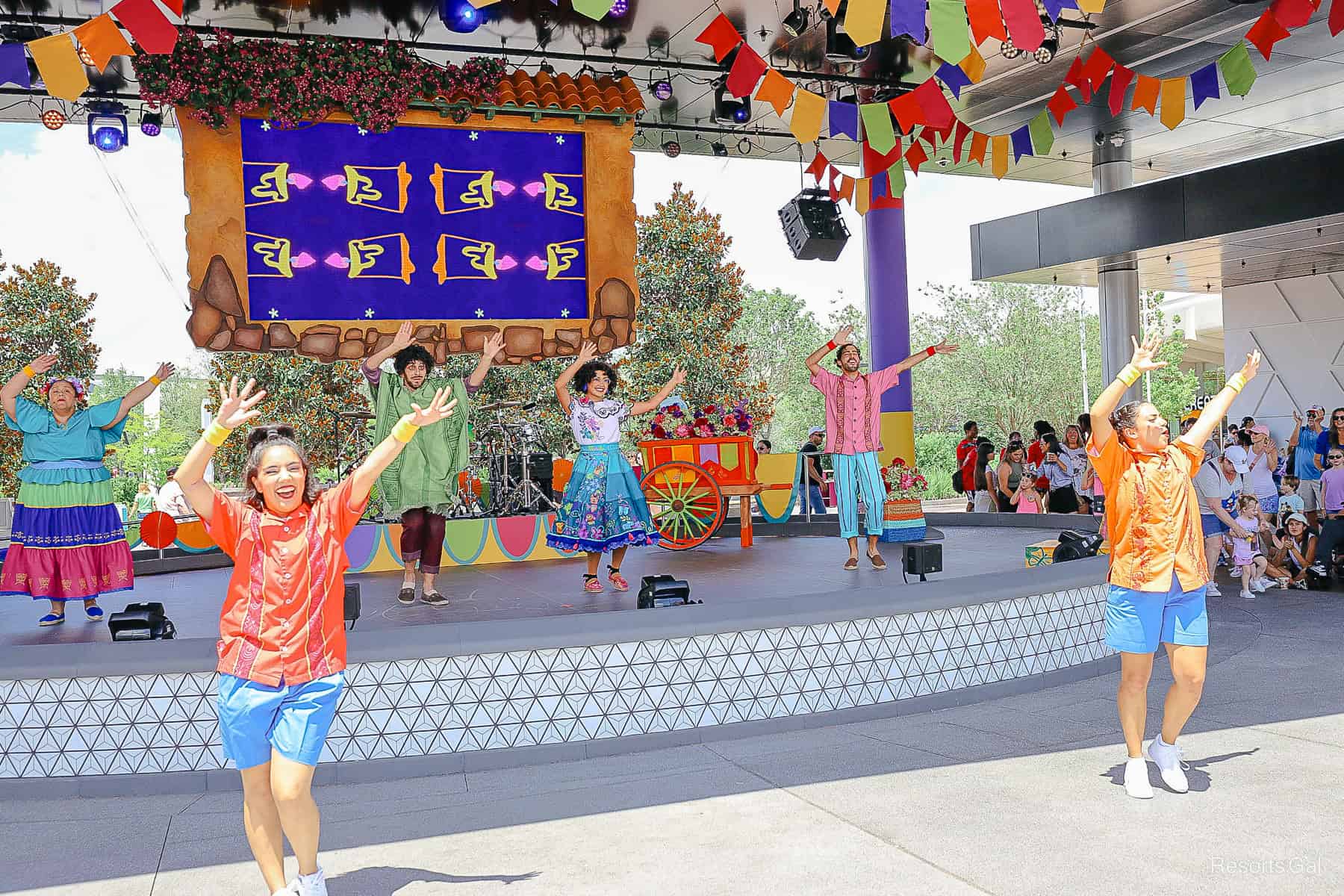 the stage for Celebration Encanto at Epcot with performers 