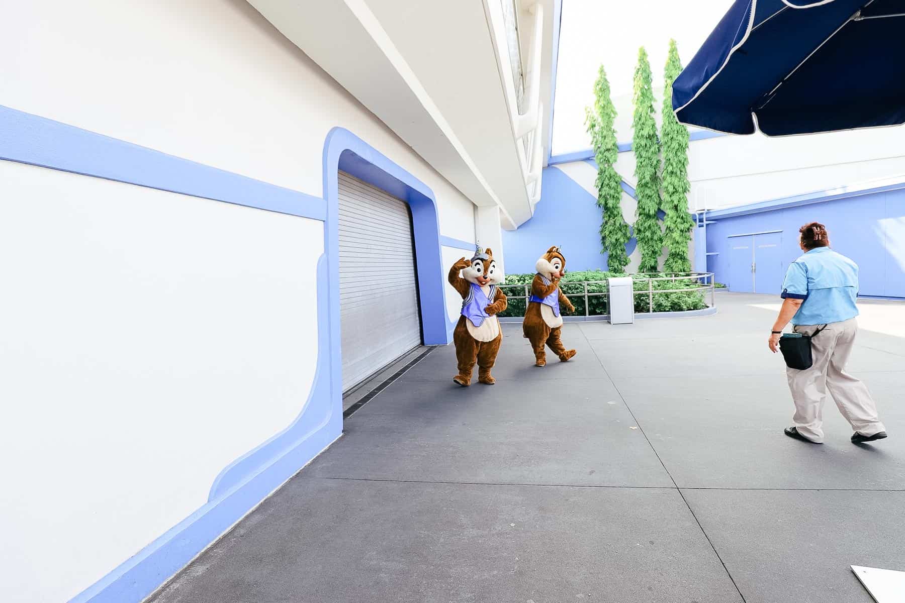 Chip and Dale are preparing to leave and waving goodbye to guests.