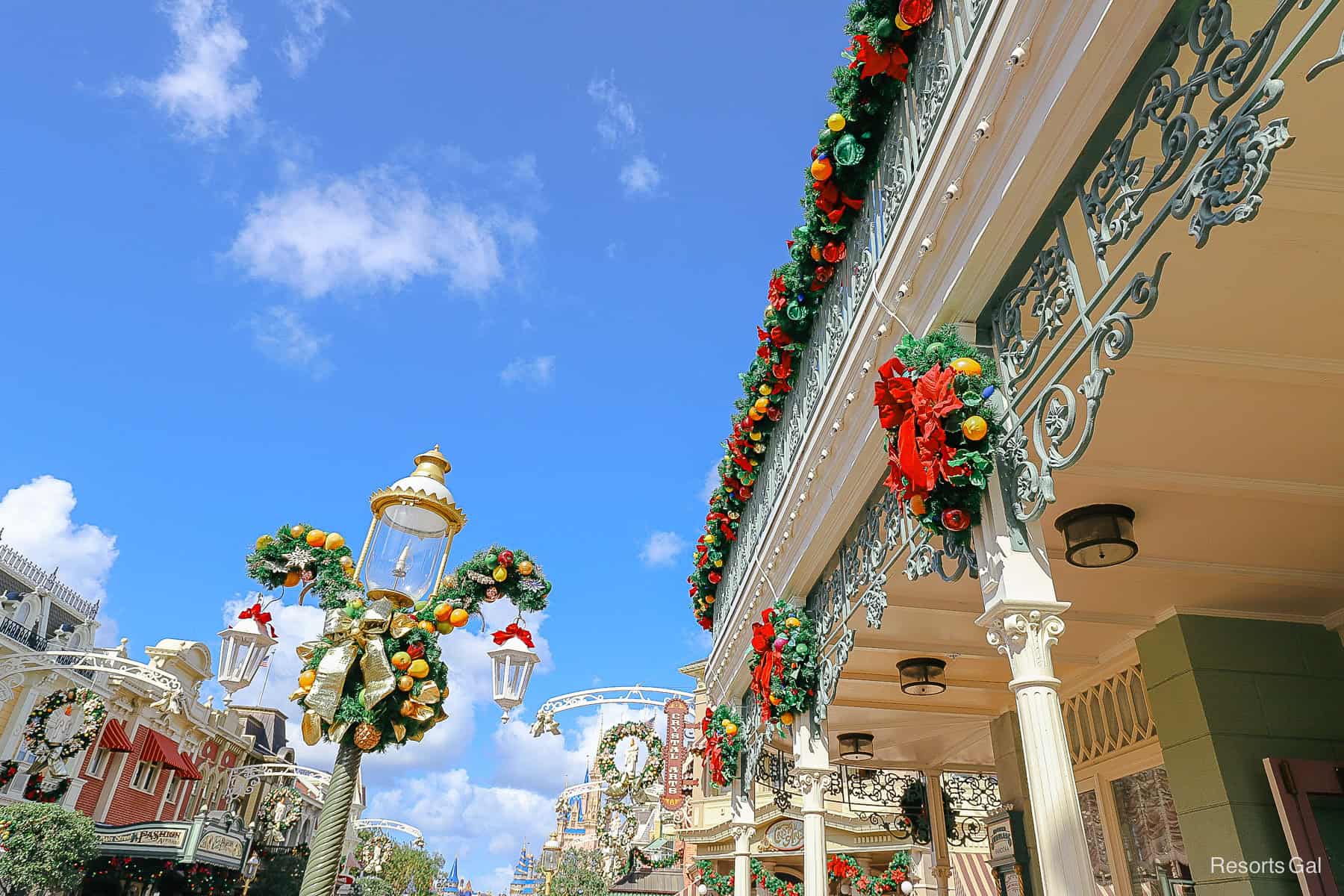 light poles on Main Street USA wrapped in Mickey Wreaths 