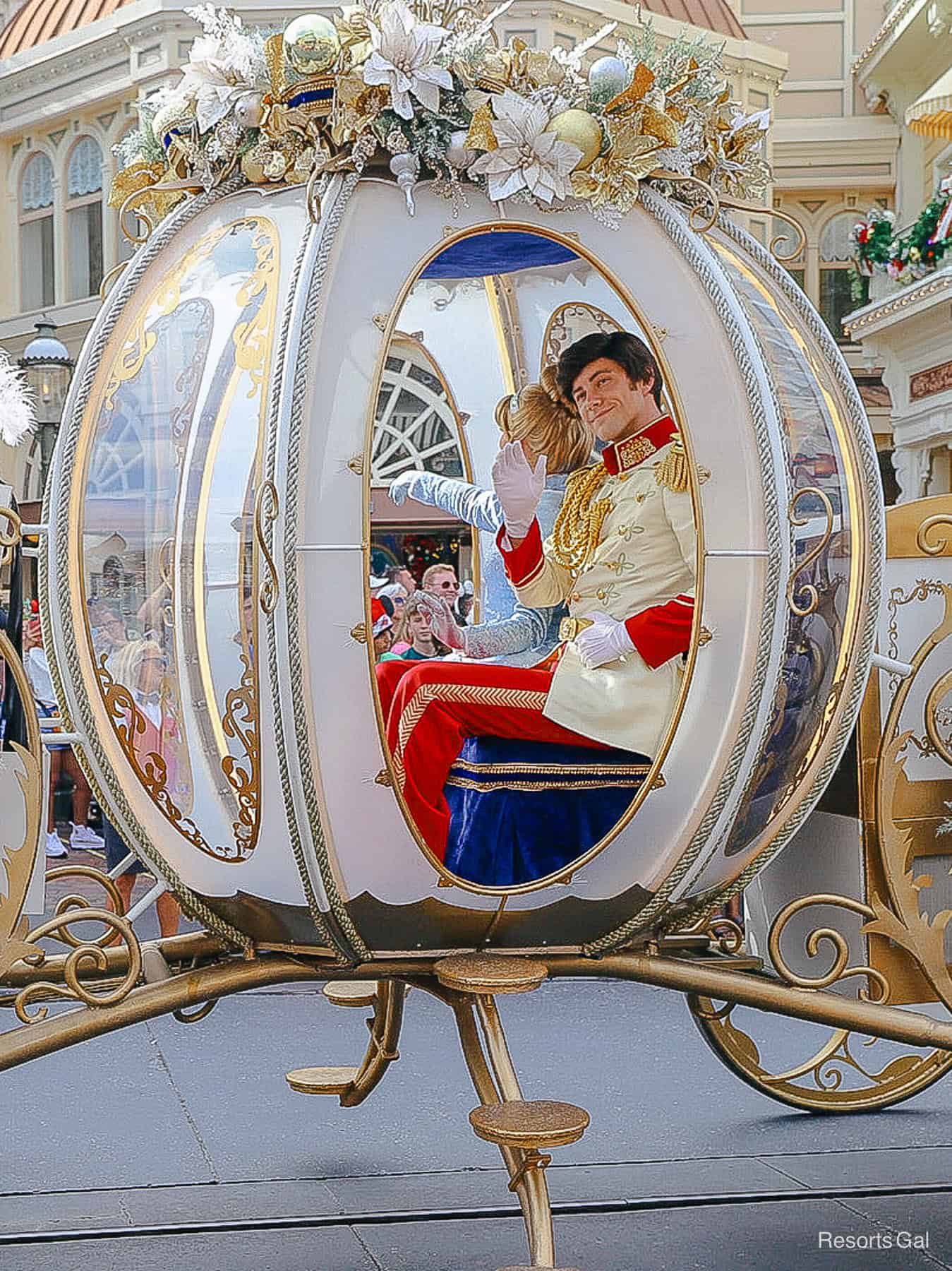 Prince Charming waves from the carriage