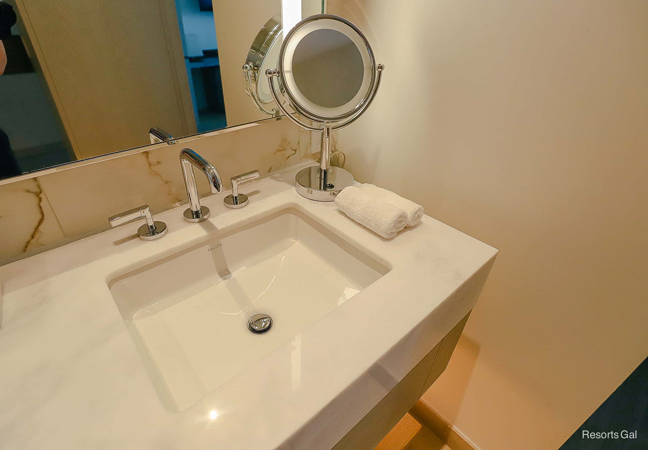 a makeup mirror in the bathroom of the guest room at the Conrad Hotel near Walt Disney World 