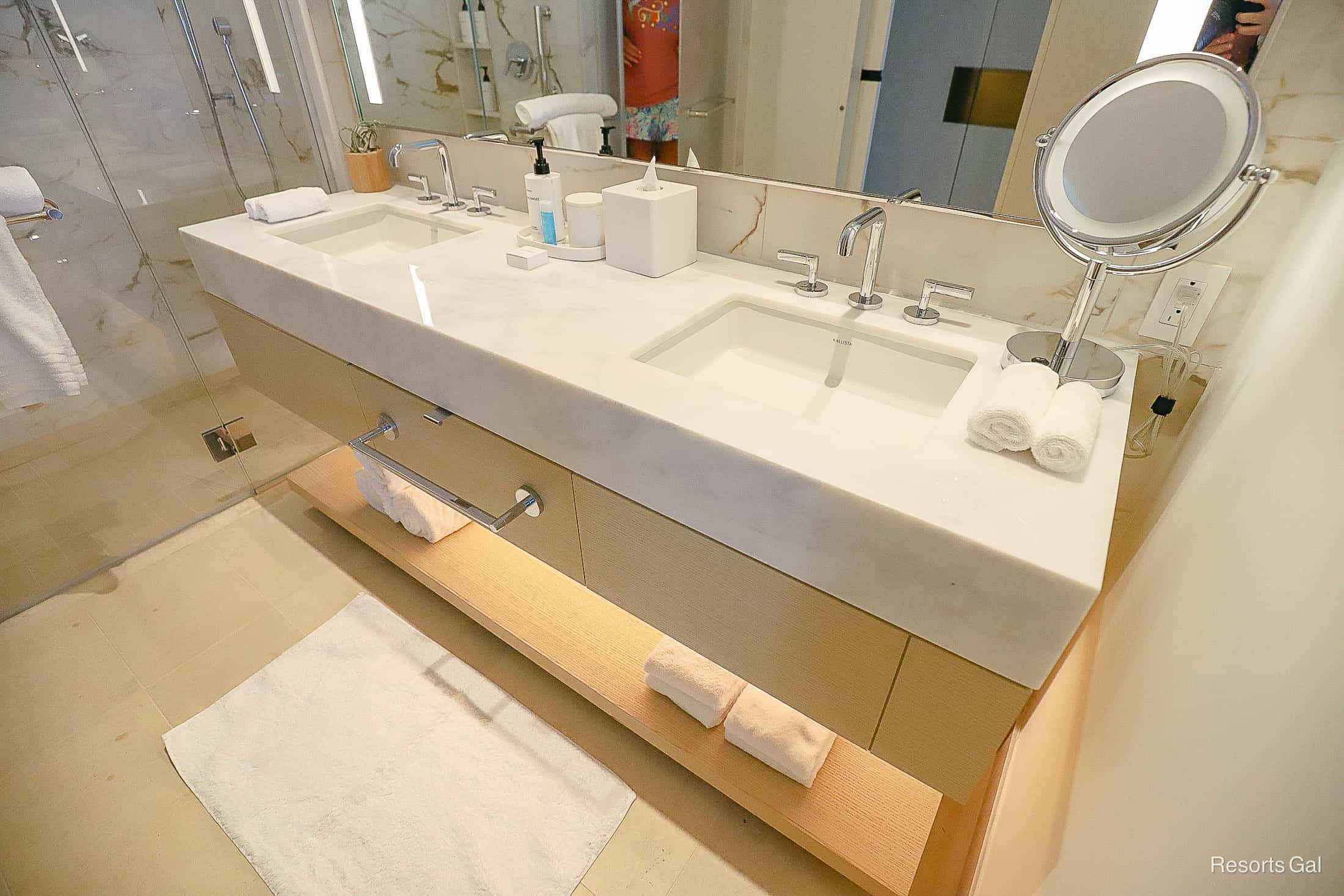 a vanity area with plenty of amenities at the Hilton Conrad Hotel 