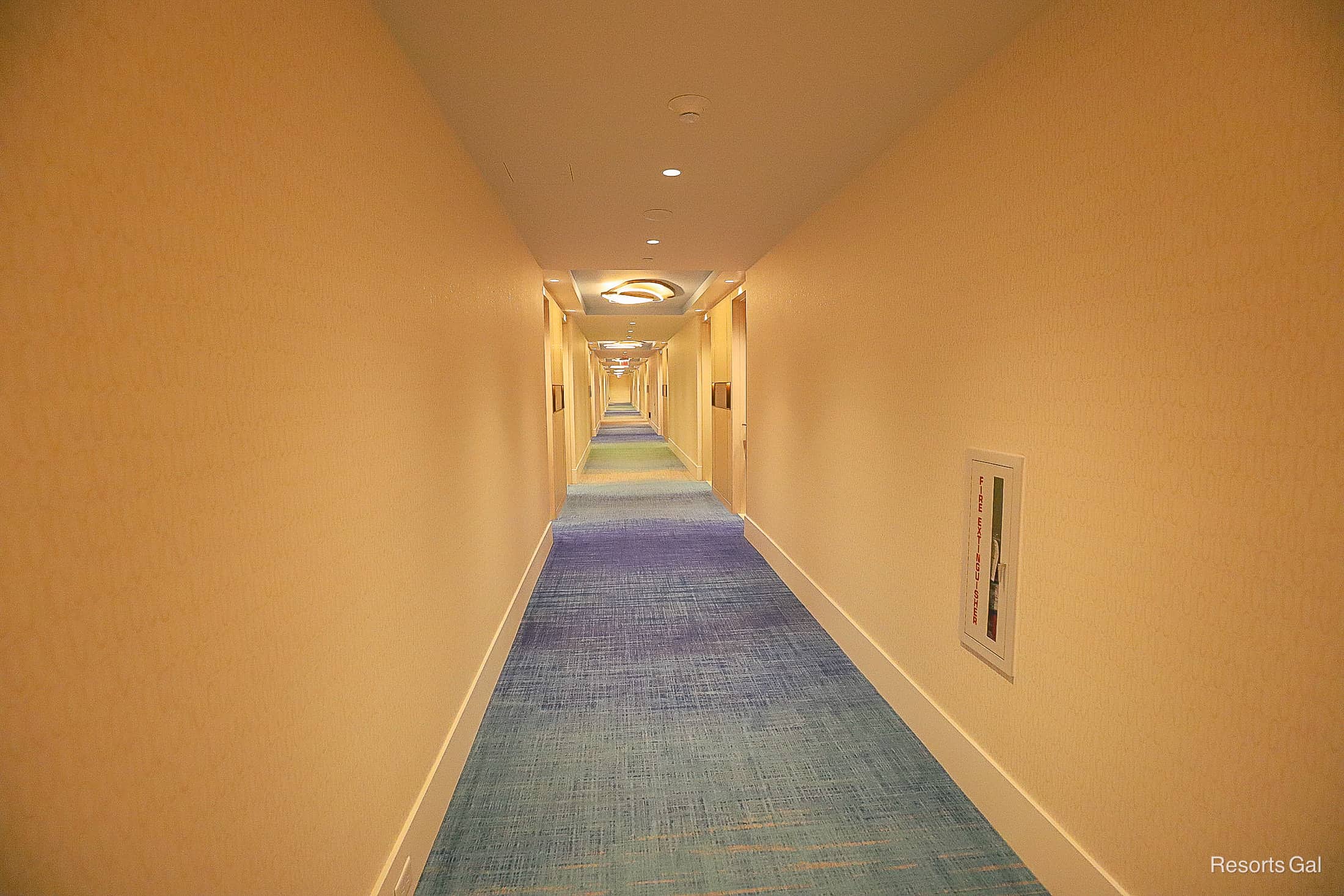 a hallway that leads to guest rooms in the Conrad Orlando 