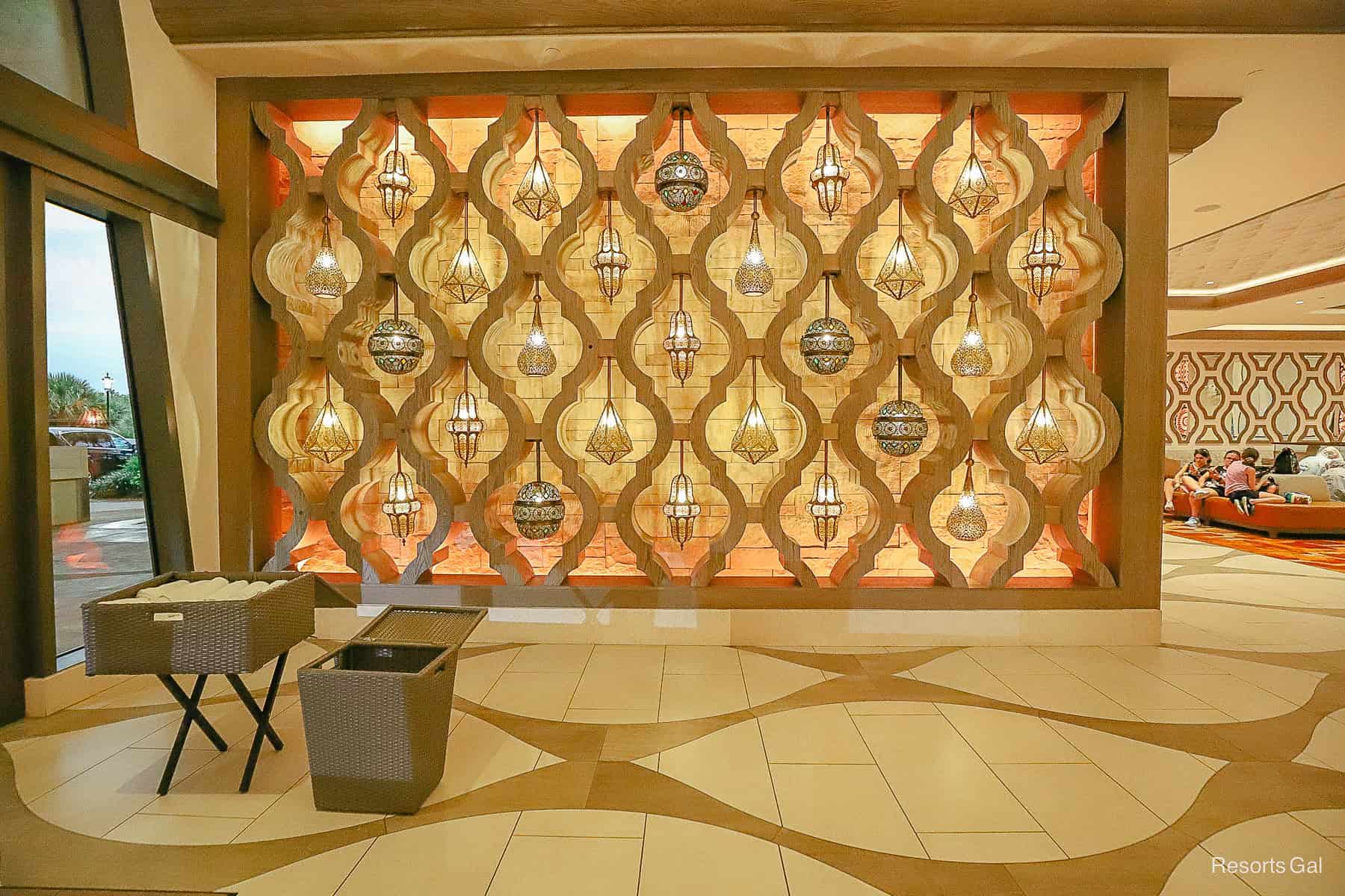 a wall of lanterns hanging inside the Gran Destino Tower entrance 