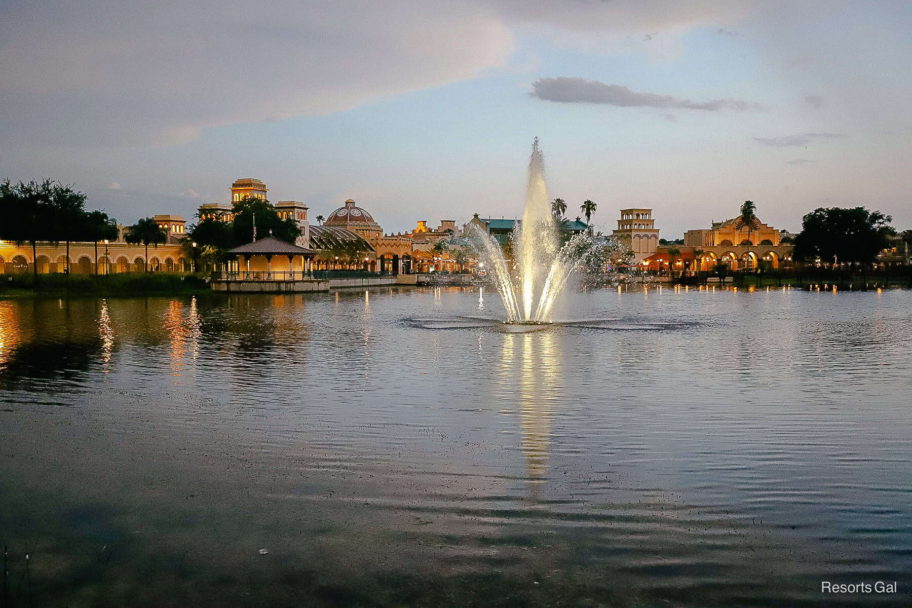 a fountain on the water with lights at night Coronado Springs 