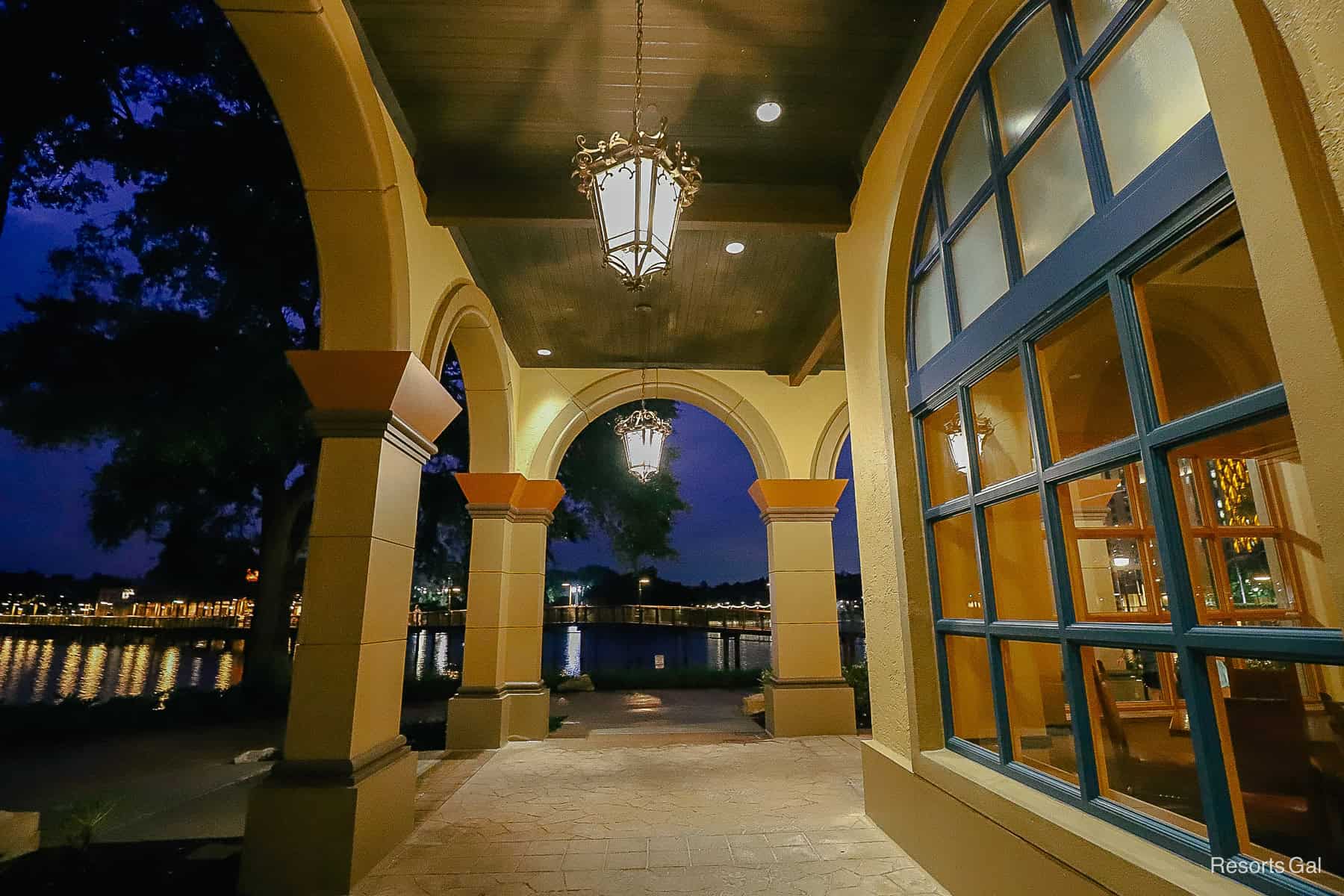 light fixtures at night over an exterior walkway at Coronado Springs 