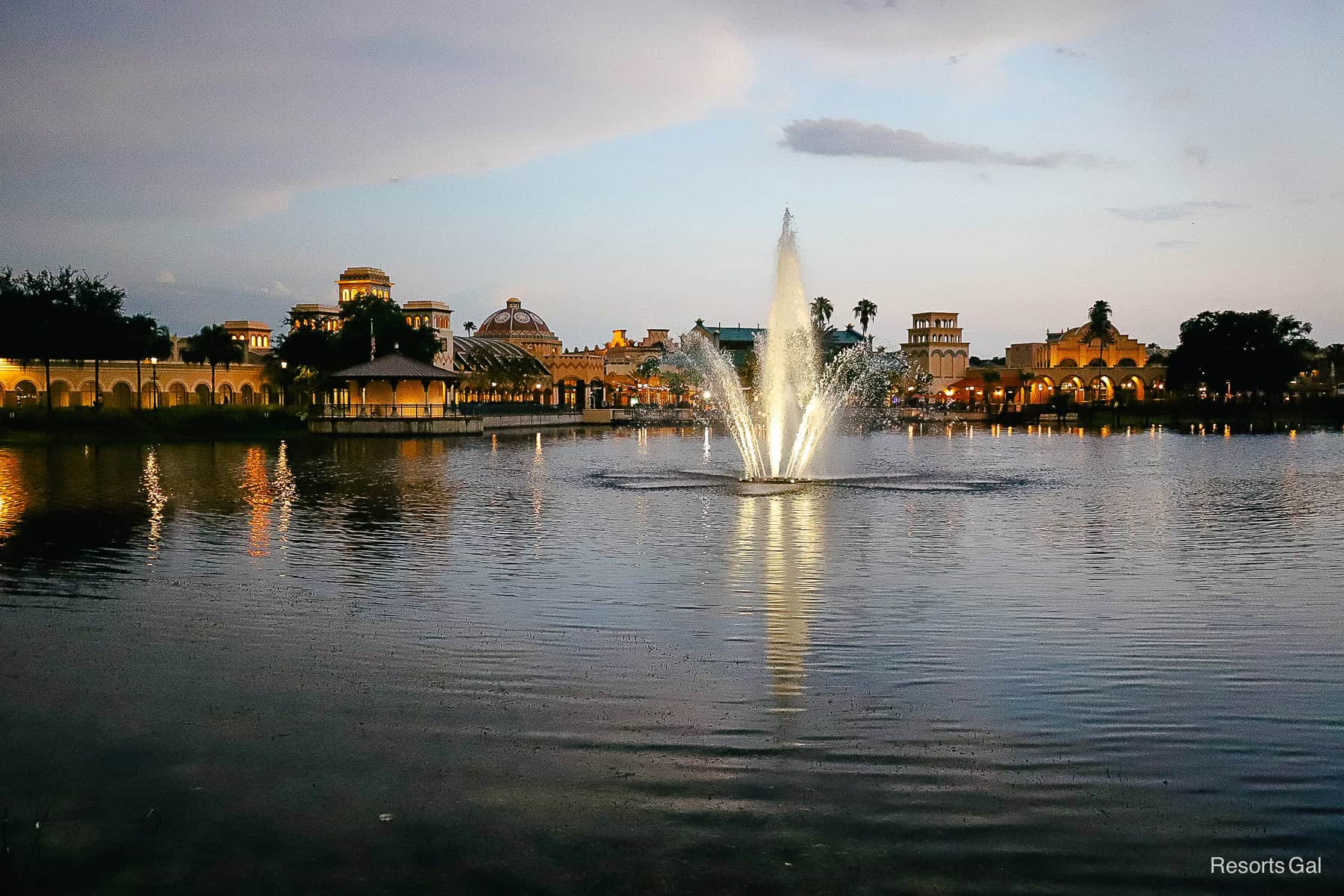 Disney's Coronado Springs nighttime fountain on lake with El Centro Backdrop 