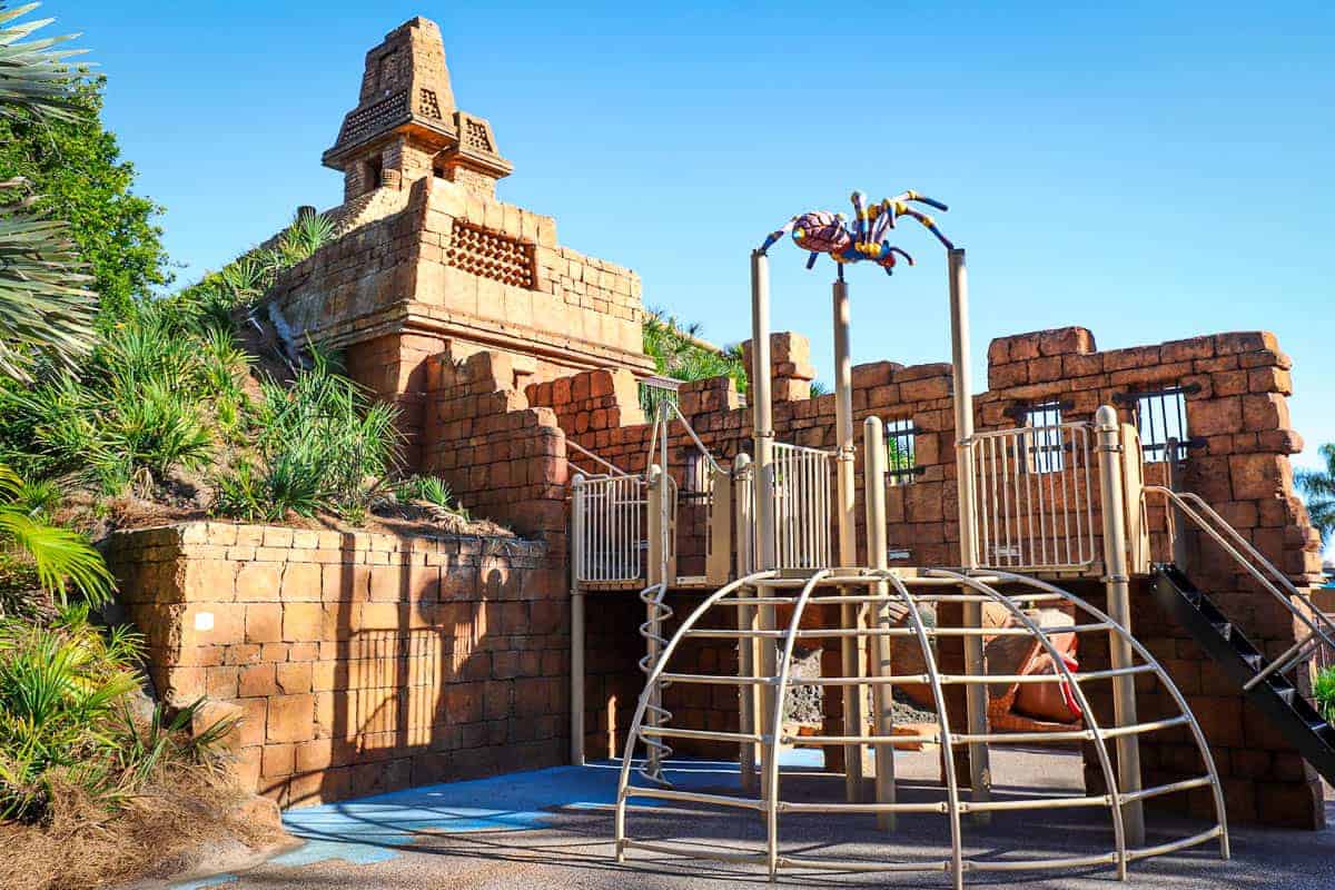 a playground area with a jungle gym 
