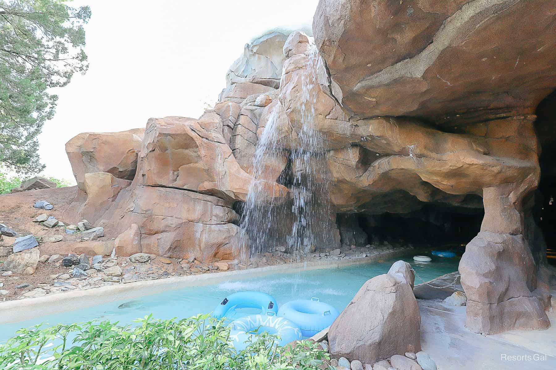 A waterfall runs over the entrance to the cave in the lazy river at Blizzard Beach. 