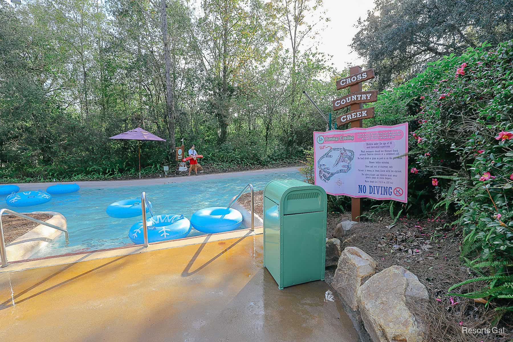 A sign for Flamingo Landing at Cross Country Creek lazy river. 