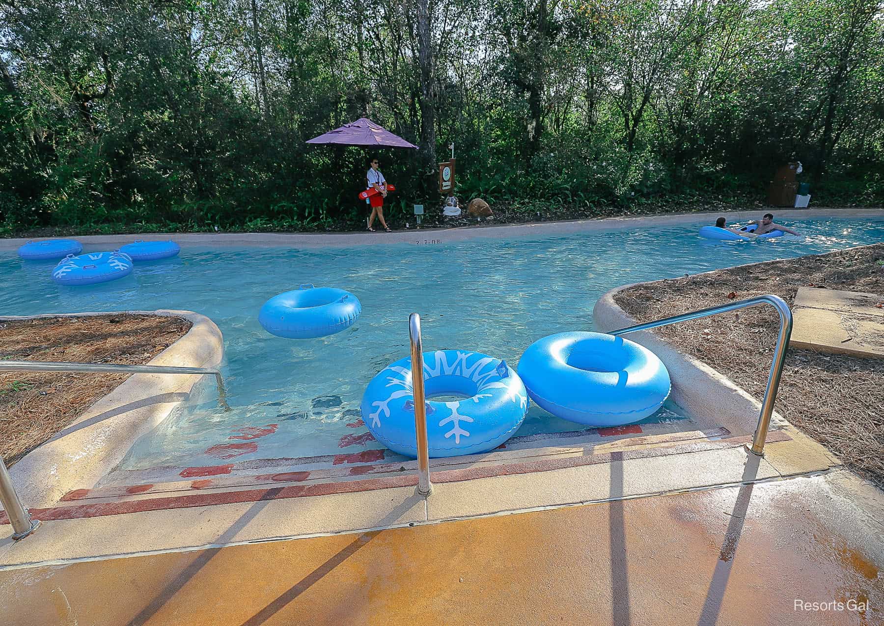 Two floats sitting on the landing steps for the lazy river.