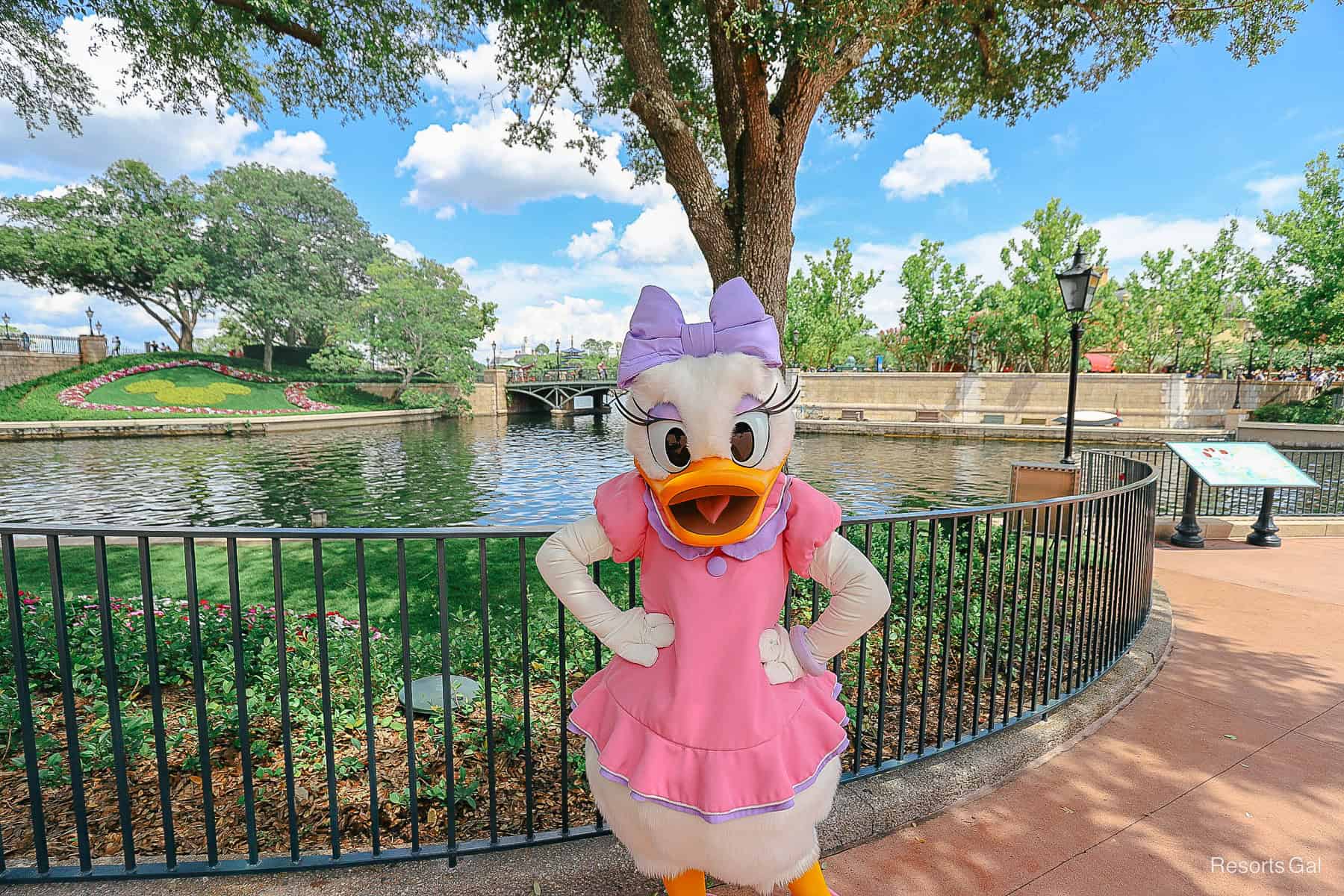 Daisy poses at the International Gateway with hands on hips. 