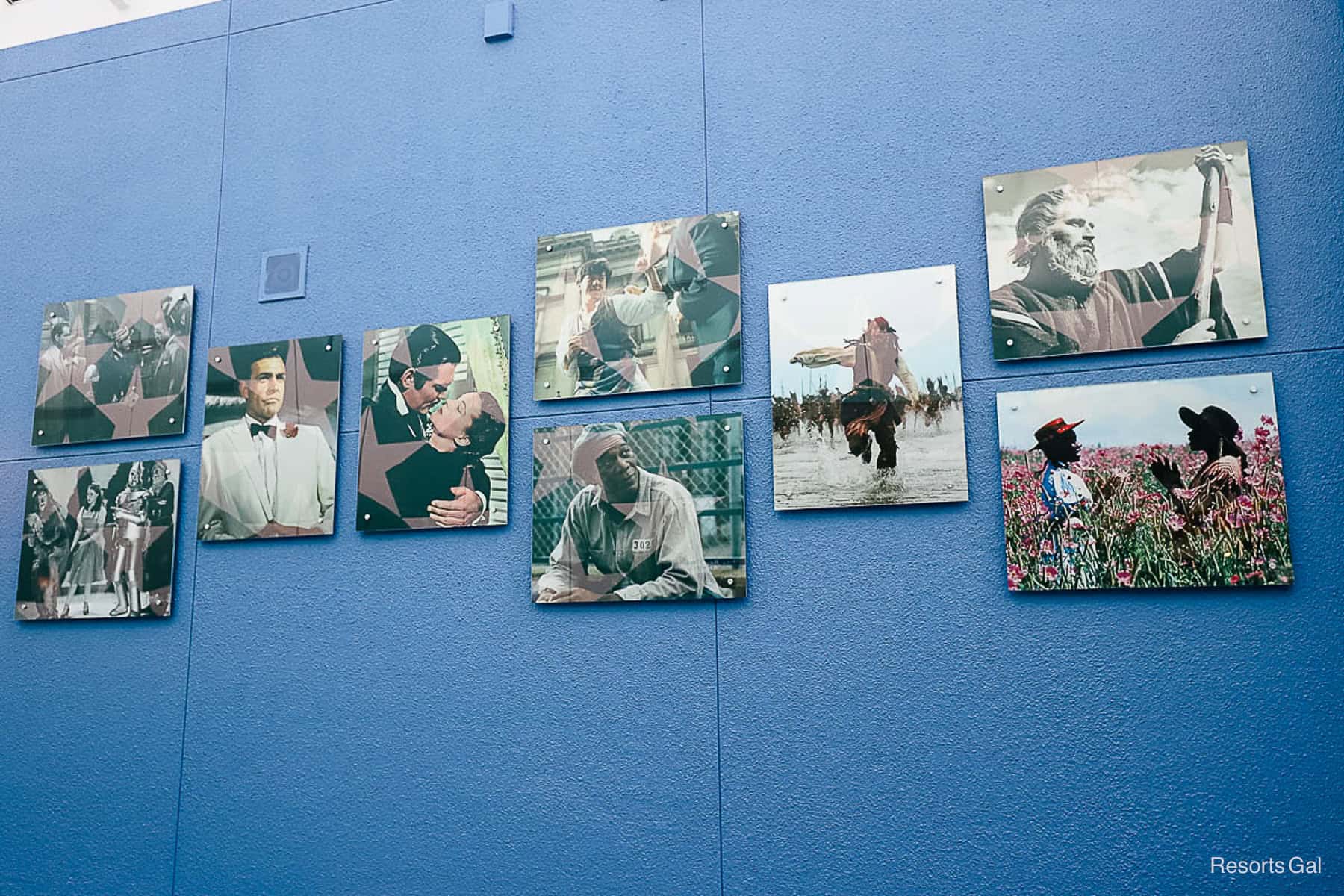 a blue wall with images of popular movies over time 