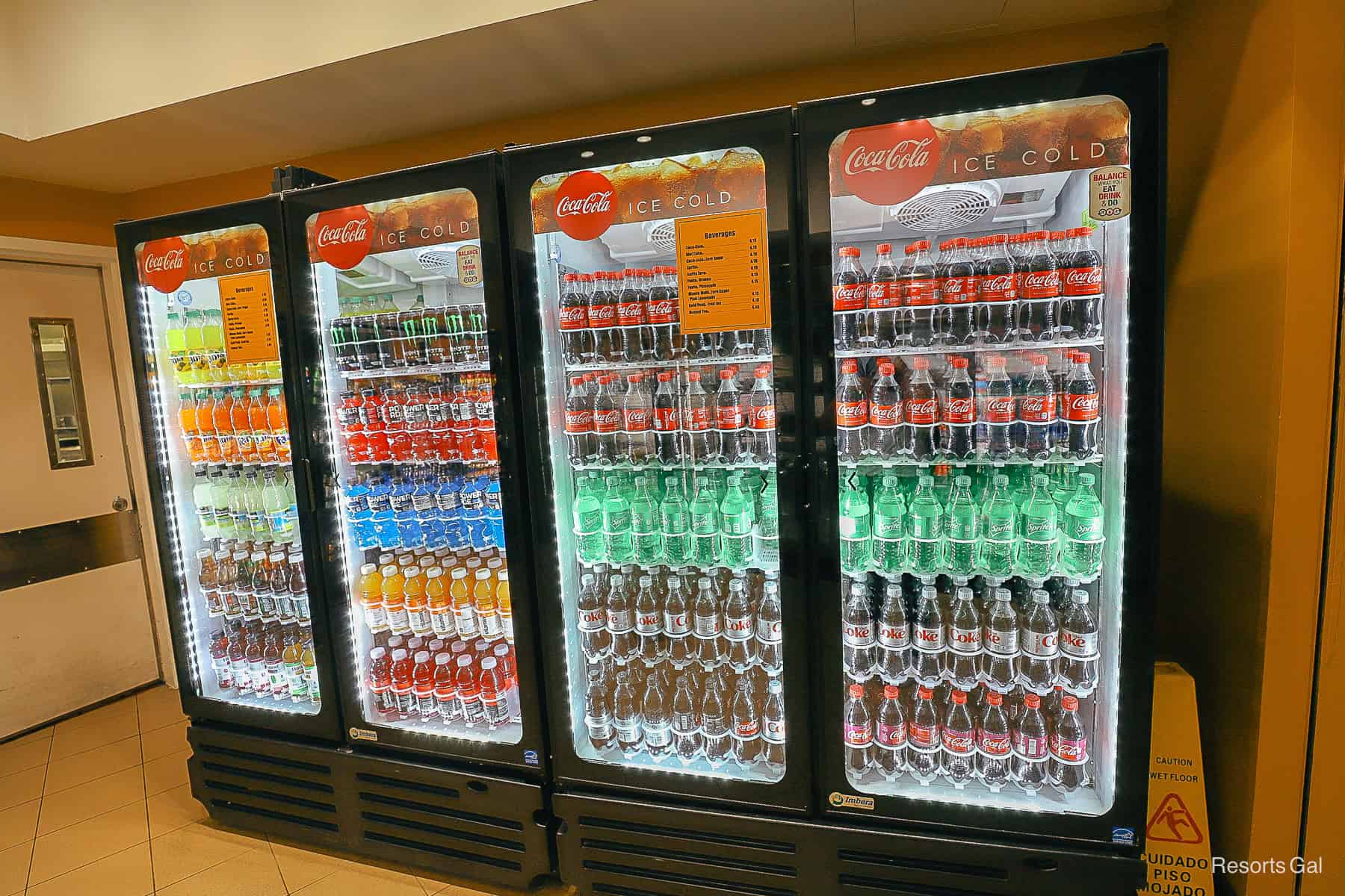 a refrigerated case with Coca Cola products at All-Star Music 