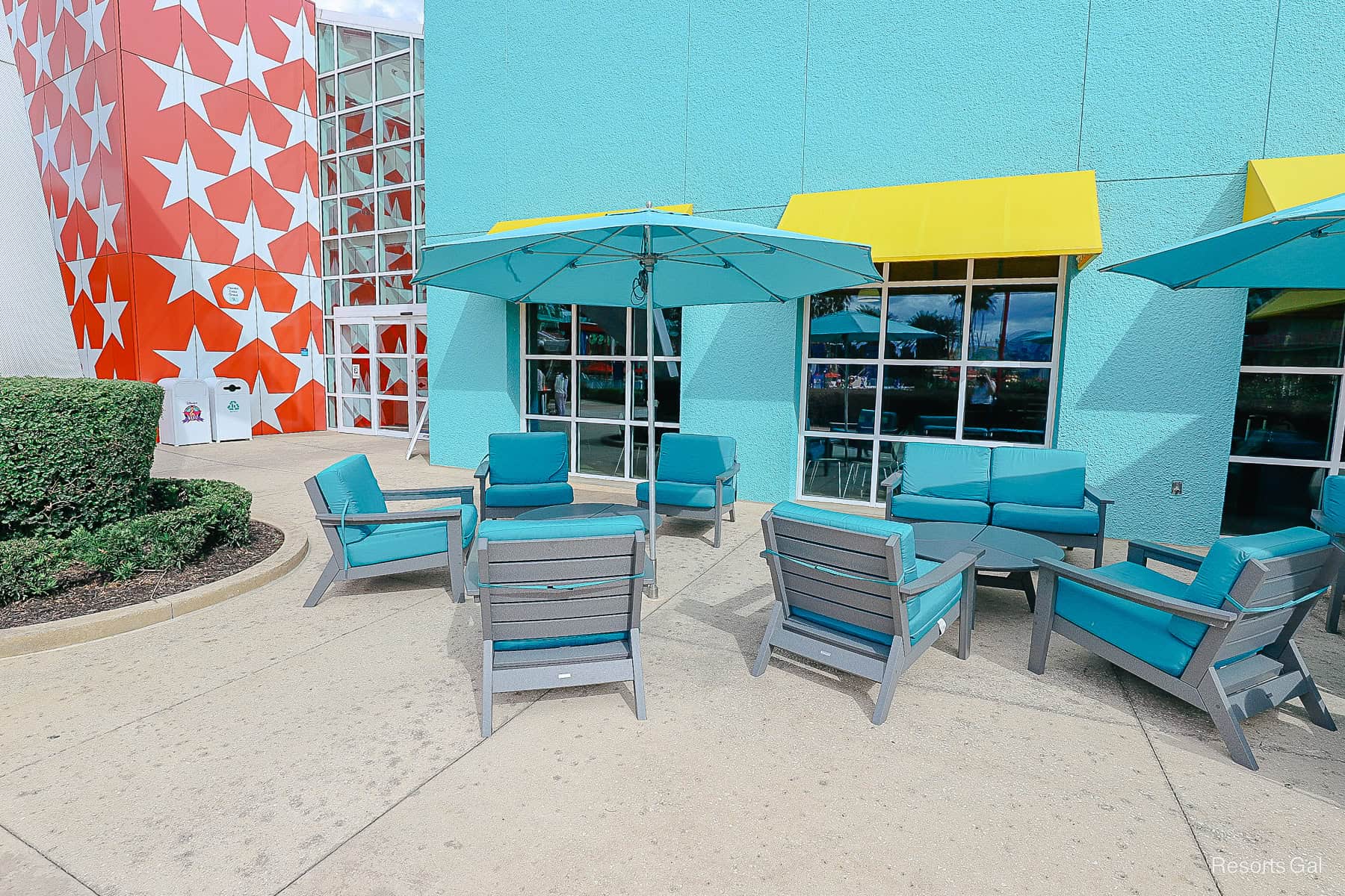 an outdoor seating area near the food court and bar at Disney's All-Star Music 