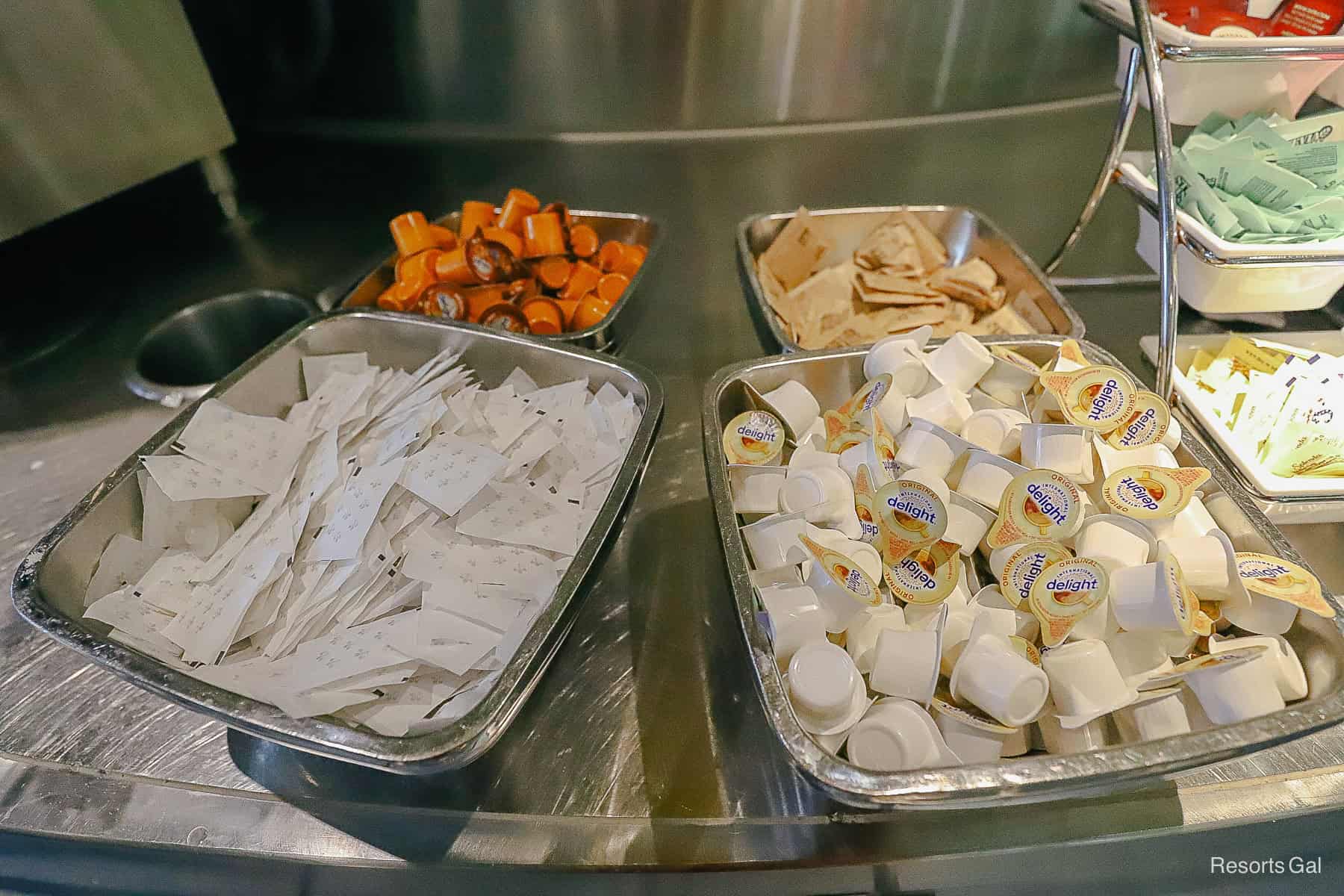 a selection of coffee creamer and regular sugar for coffee 